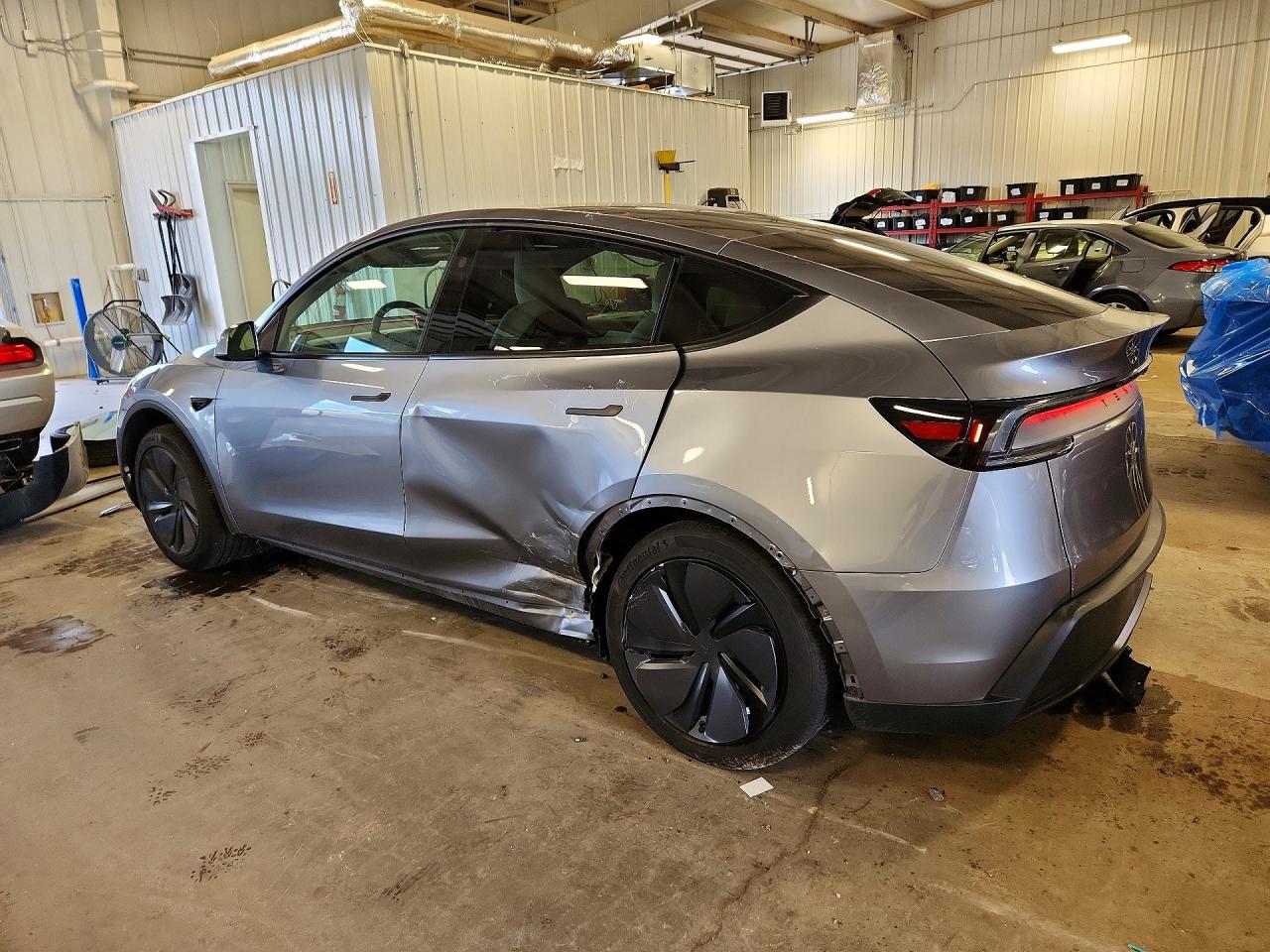 2026 Tesla Model Y Silver vin: 7SAYGDED2TF585996