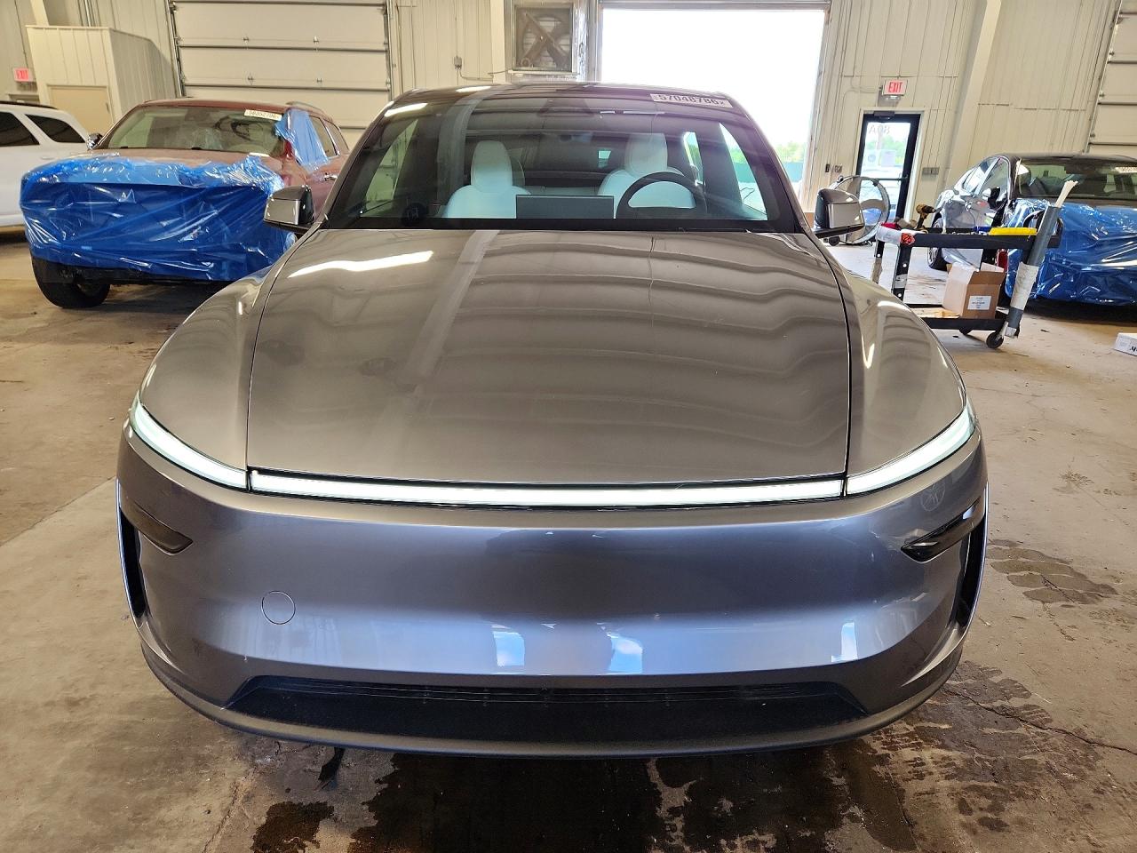 2026 Tesla Model Y Silver vin: 7SAYGDED2TF585996