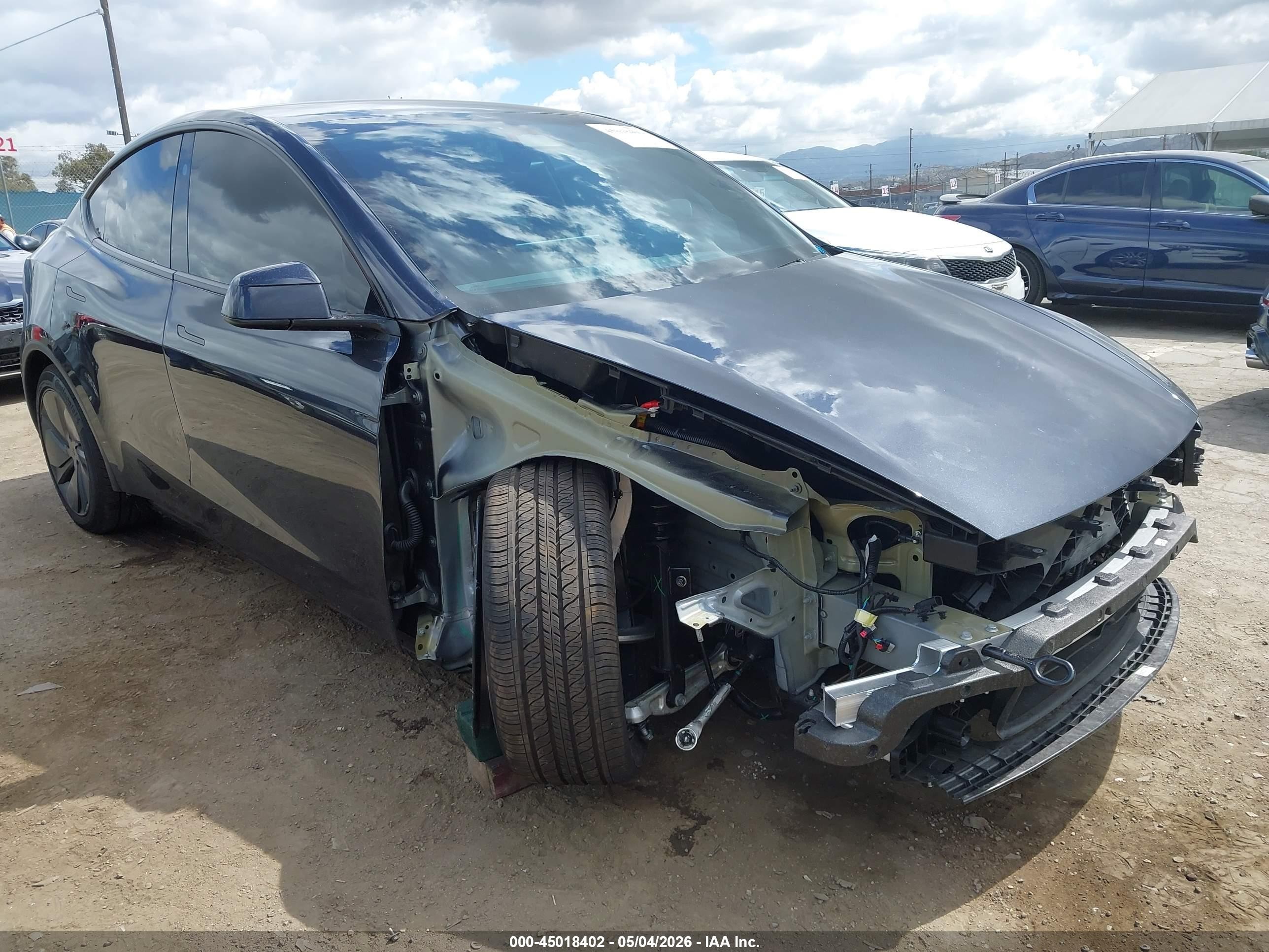2026 Tesla Model Y Black vin: 7SAYGDED5TF568352