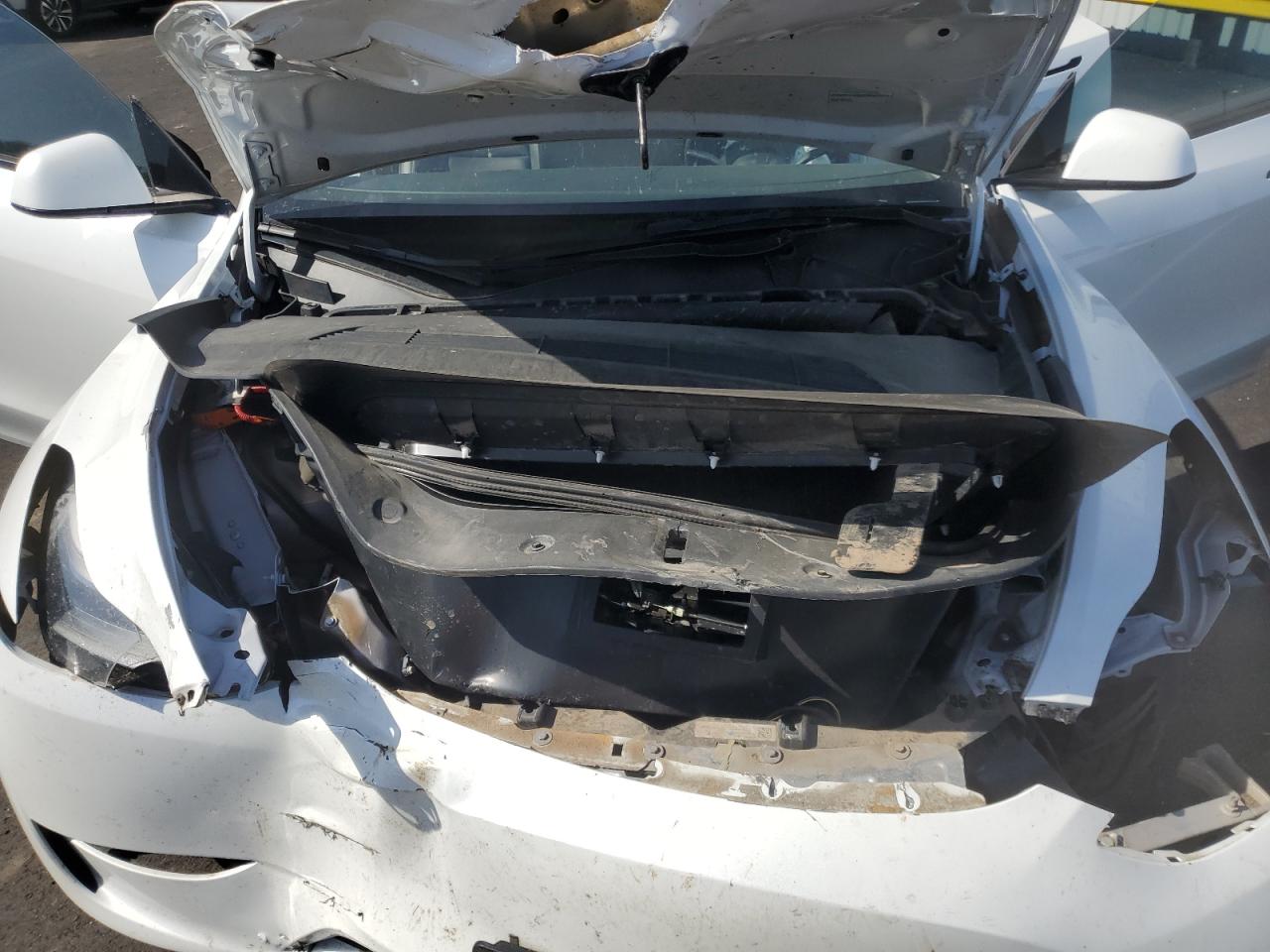 2023 Tesla Model Y White vin: 7SAYGDEEXPF637972 Damage: Left Front Rail, Kinked, > 12 Inches