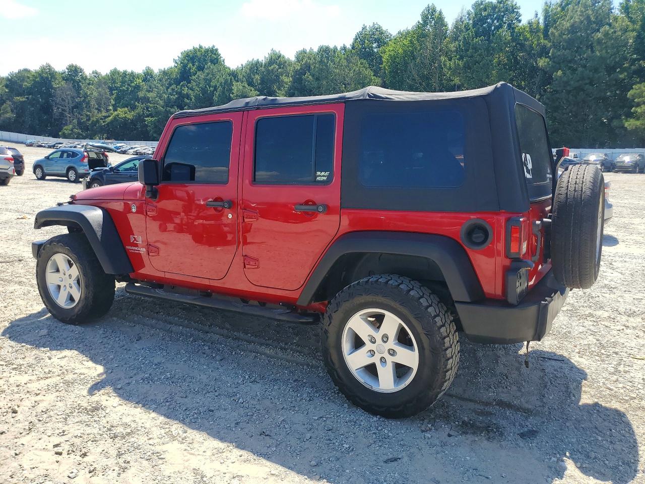 2009 Jeep Wrangler Unlimited X Red vin: 1J4GA39149L767302