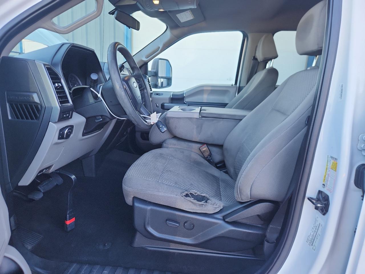 2021 Ford F250 Super Duty White vin: 1FT7W2BT1MED72780 Damage: Left Front Seat Cushion, Torn, 6 To 7 Inches
