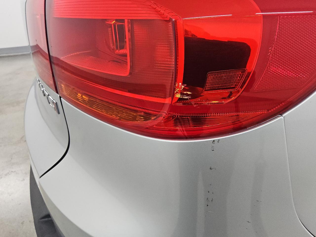2014 Volkswagen Tiguan S Silver vin: WVGAV3AX9EW603354 Damage: Right Tail Light, Broken, Replacement Required