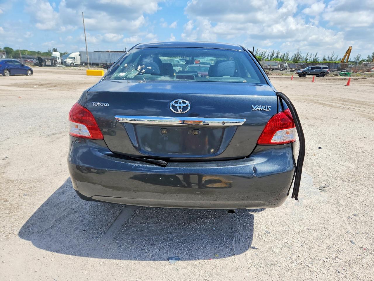 2011 Toyota Yaris Base Black vin: JTDBT4K34BL002107