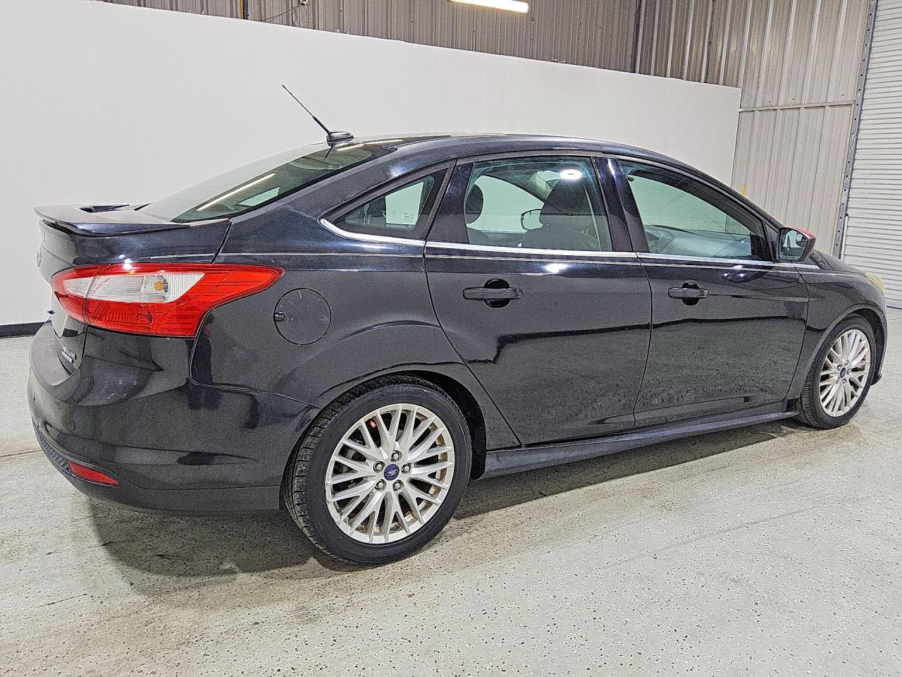 2014 Ford Focus Titanium Black vin: 1FADP3J29EL104156