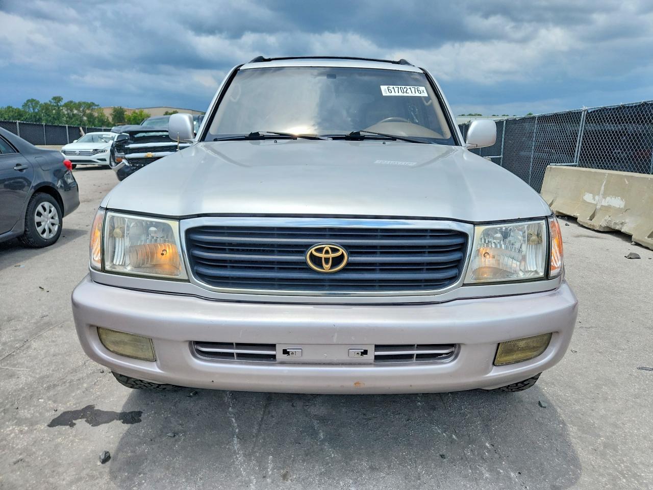 1999 Toyota Land Cruiser Base Gold vin: JT3HT05J5X0027141