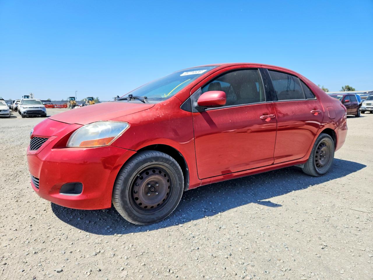 2009 Toyota Yaris Base Red vin: JTDBT903694046372
