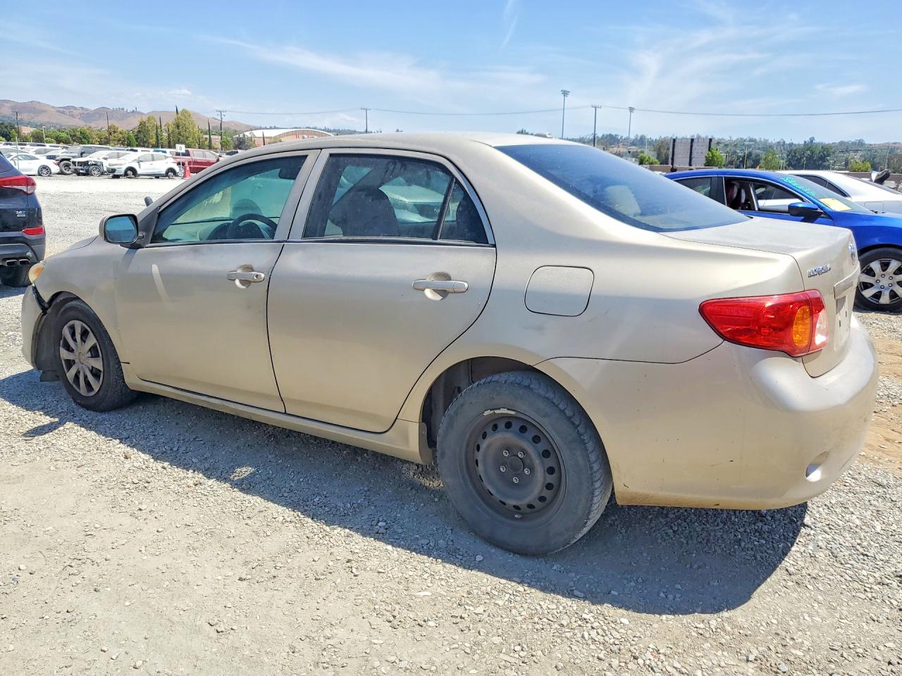 2010 Toyota Corolla Le Gold vin: 2T1BU4EE8AC354896