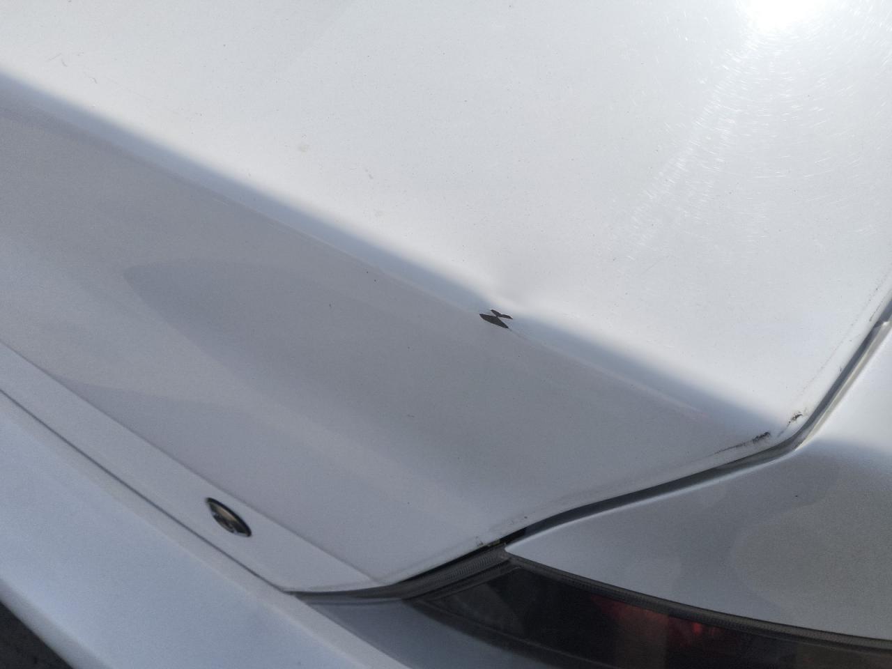 2005 Mitsubishi Lancer Evolution Rs White vin: JA3AH36D75U044942 Damage: Deck Lid, Dent(S) W/ Paint Dmg, 1/8 To 1/2 Inch