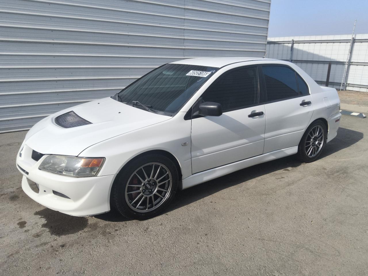 2005 Mitsubishi Lancer Evolution Rs White vin: JA3AH36D75U044942 Damage: Left Fuel Door, Loose, Repair Required