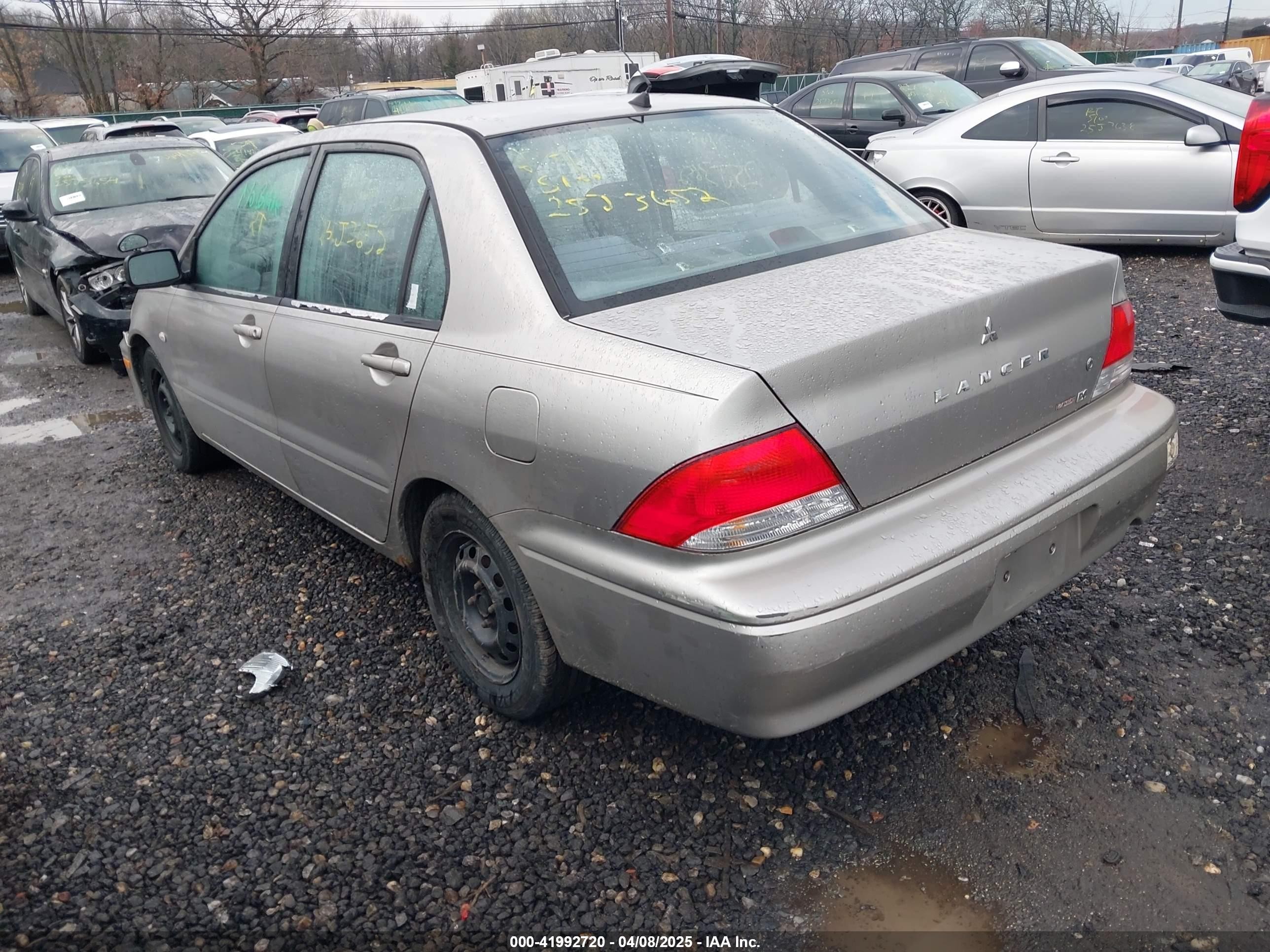 2002 Mitsubishi Lancer Es Золотой vin: JA3AJ26E32U049302