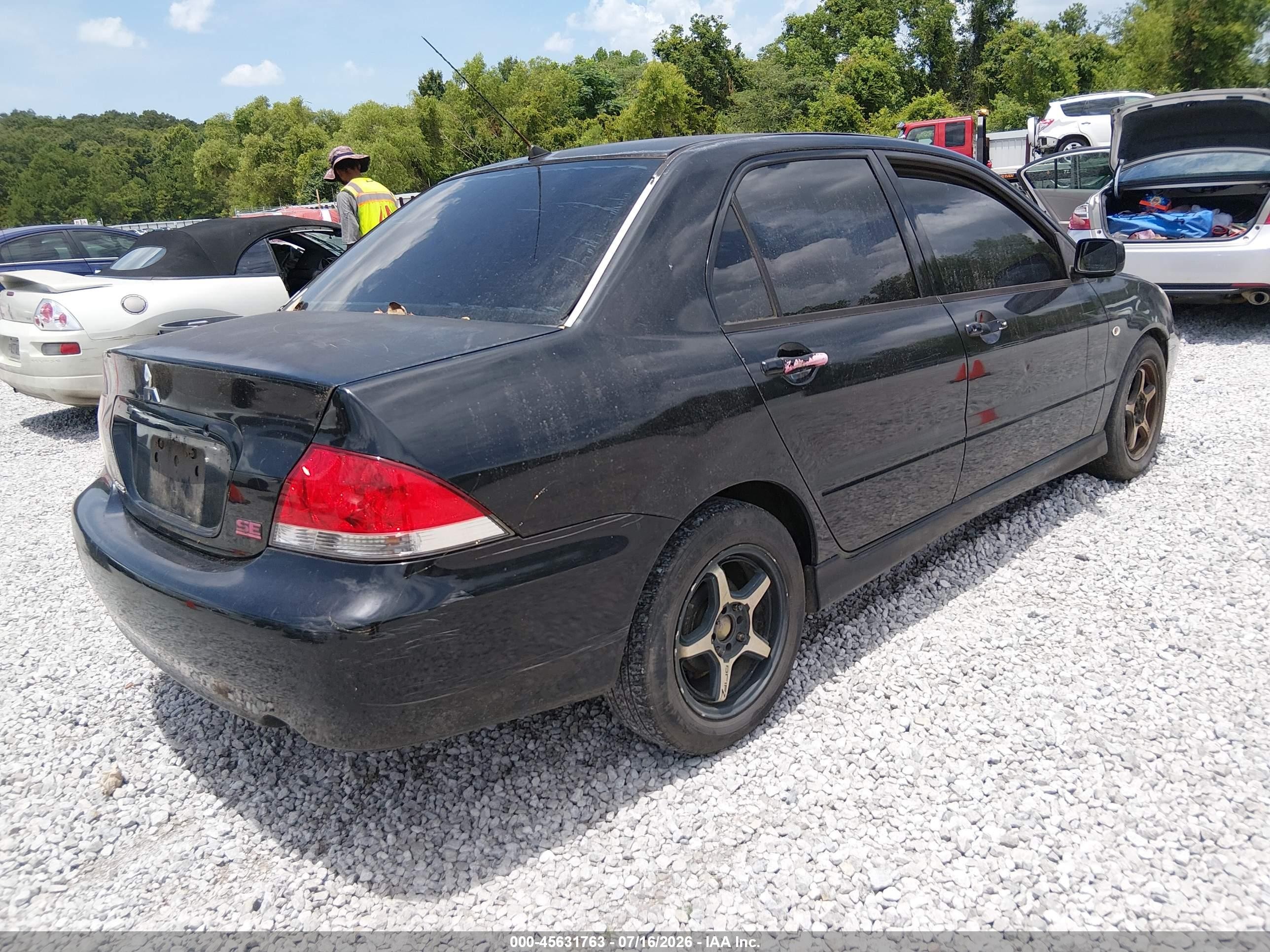 2004 Mitsubishi Lancer Oz Rally Black vin: JA3AJ86E54U030014