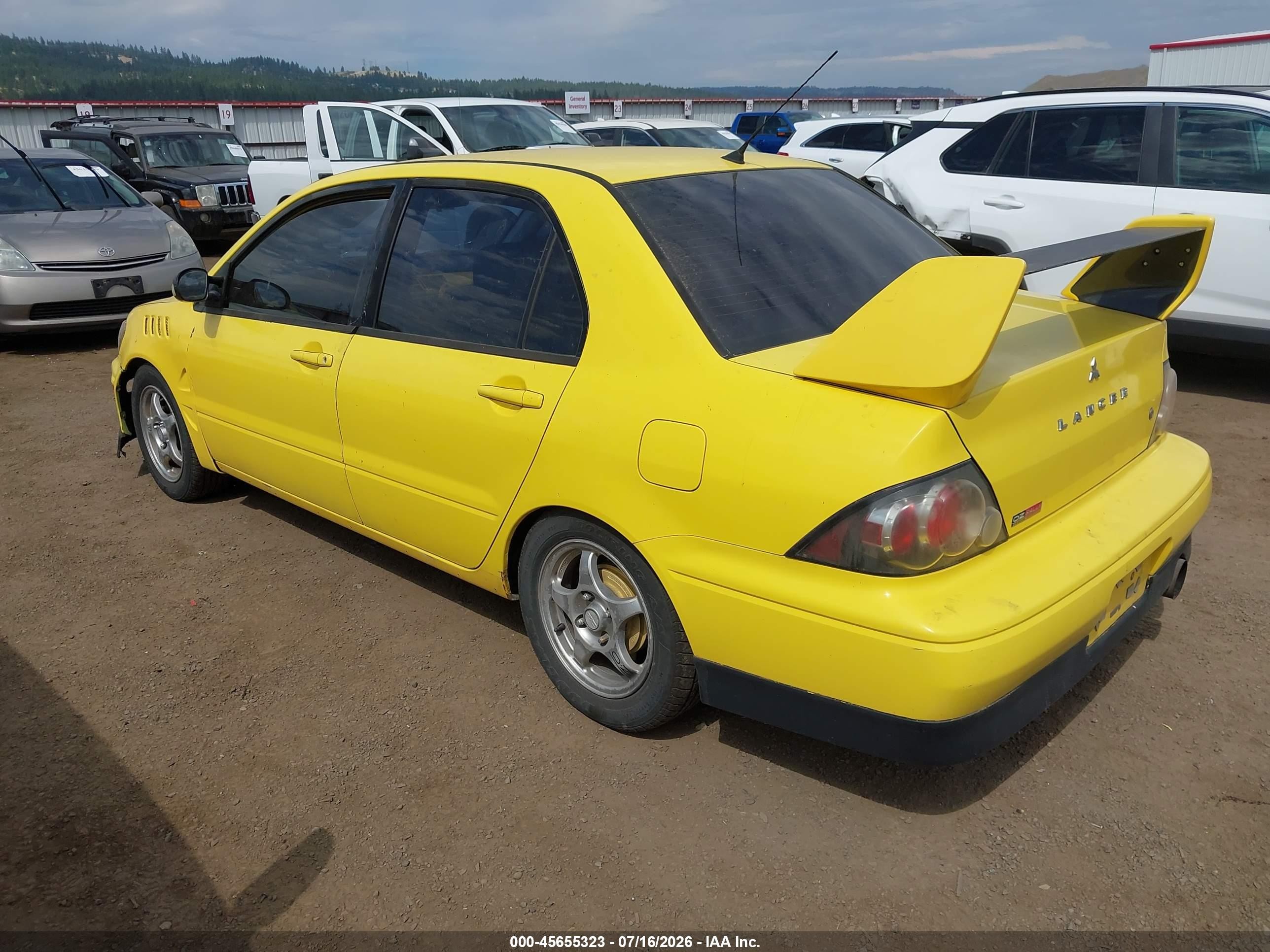 2002 Mitsubishi Lancer Oz Rally Yellow vin: JA3AJ86E82U067717