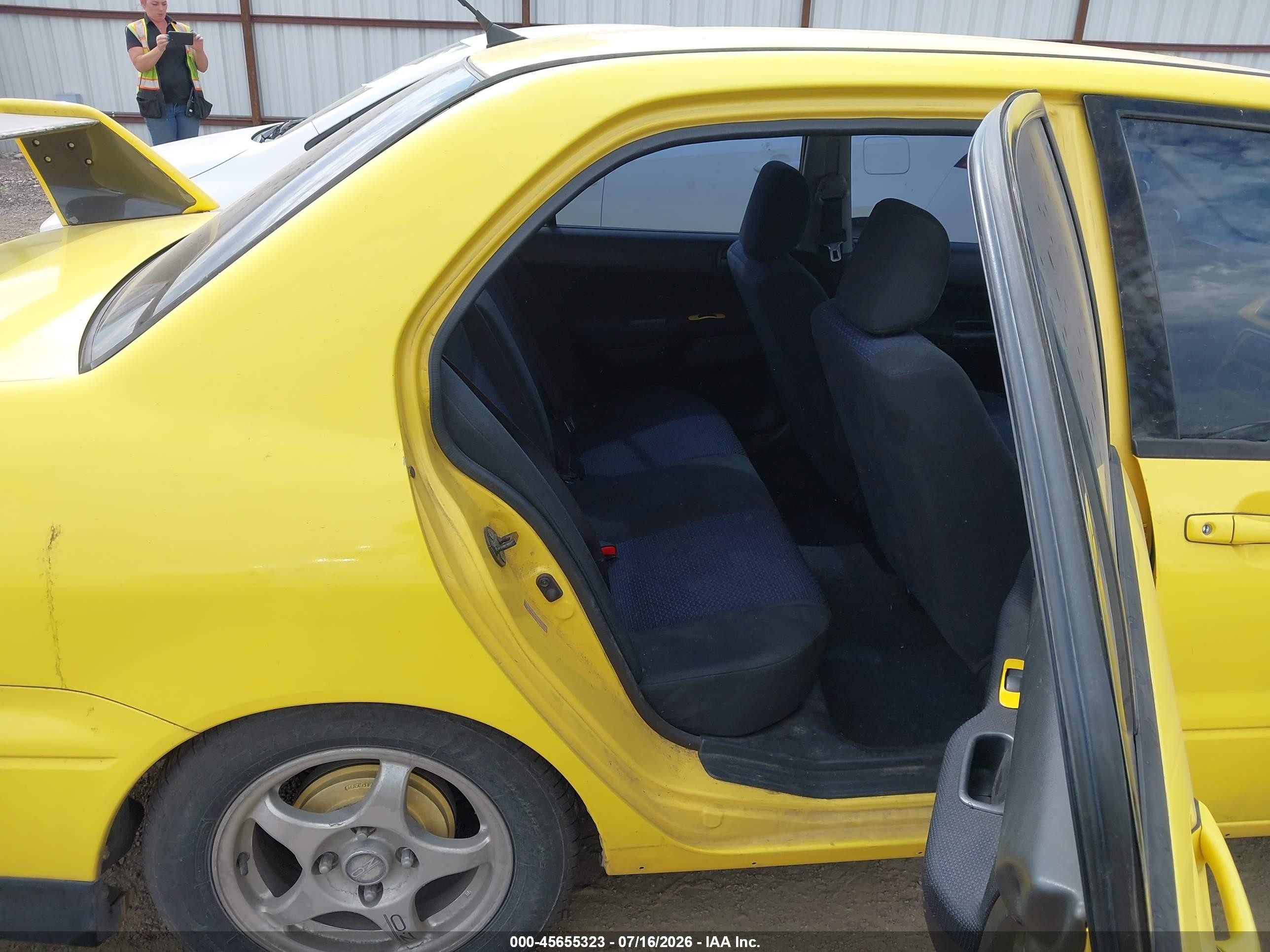 2002 Mitsubishi Lancer Oz Rally Yellow vin: JA3AJ86E82U067717