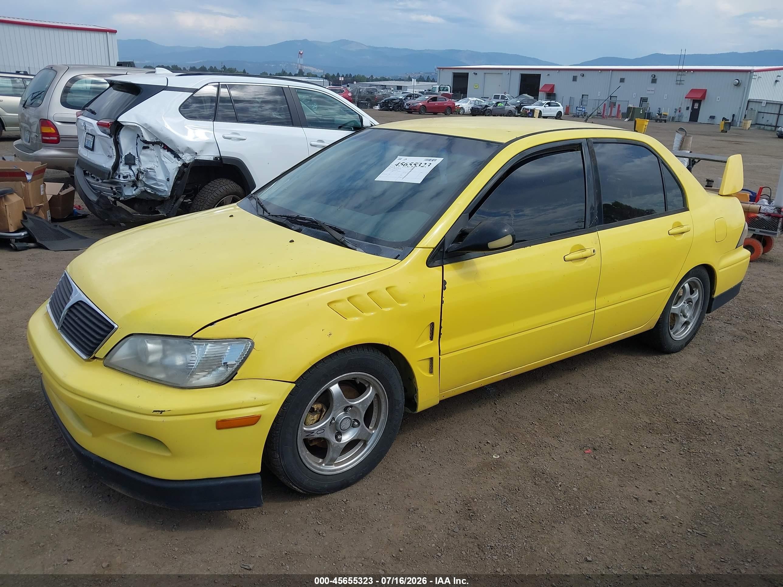 2002 Mitsubishi Lancer Oz Rally Yellow vin: JA3AJ86E82U067717