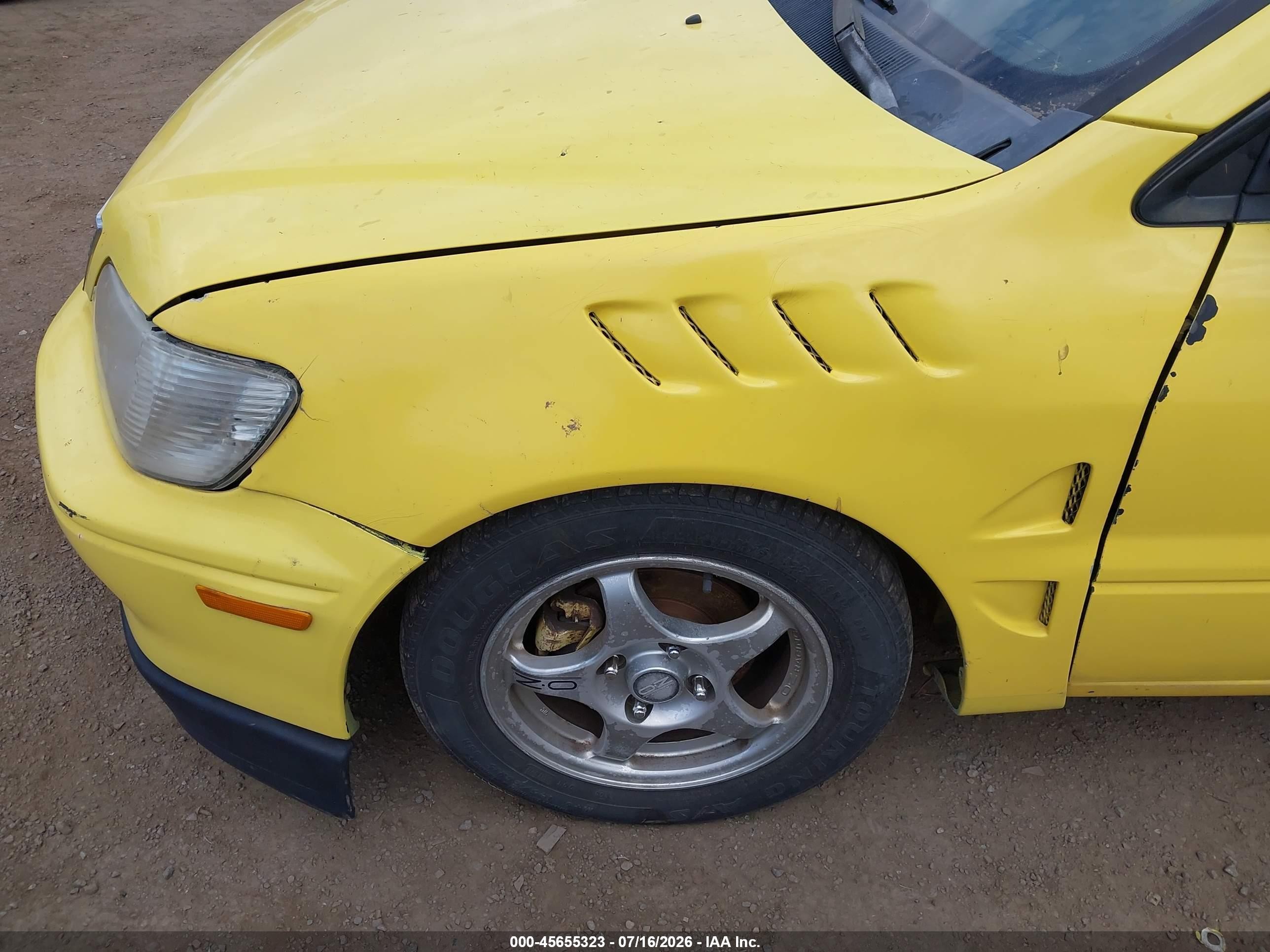 2002 Mitsubishi Lancer Oz Rally Yellow vin: JA3AJ86E82U067717