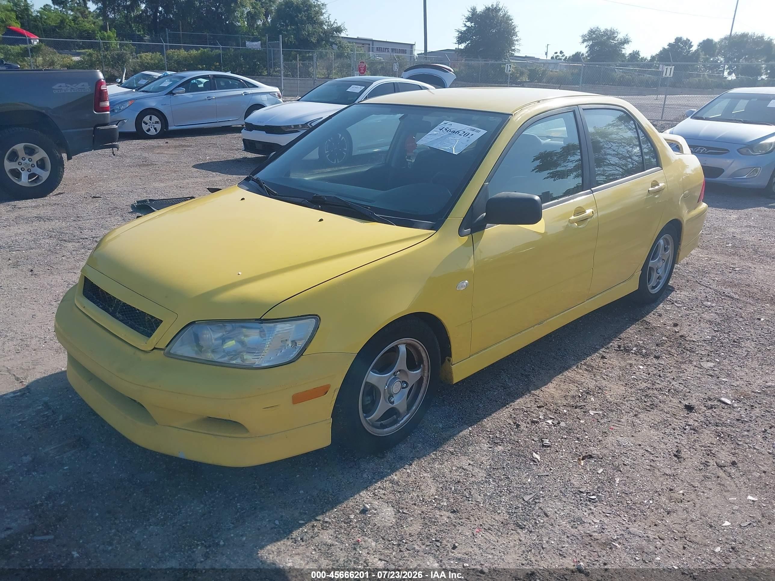 2002 Mitsubishi Lancer Oz Rally Yellow vin: JA3AJ86EX2U082509