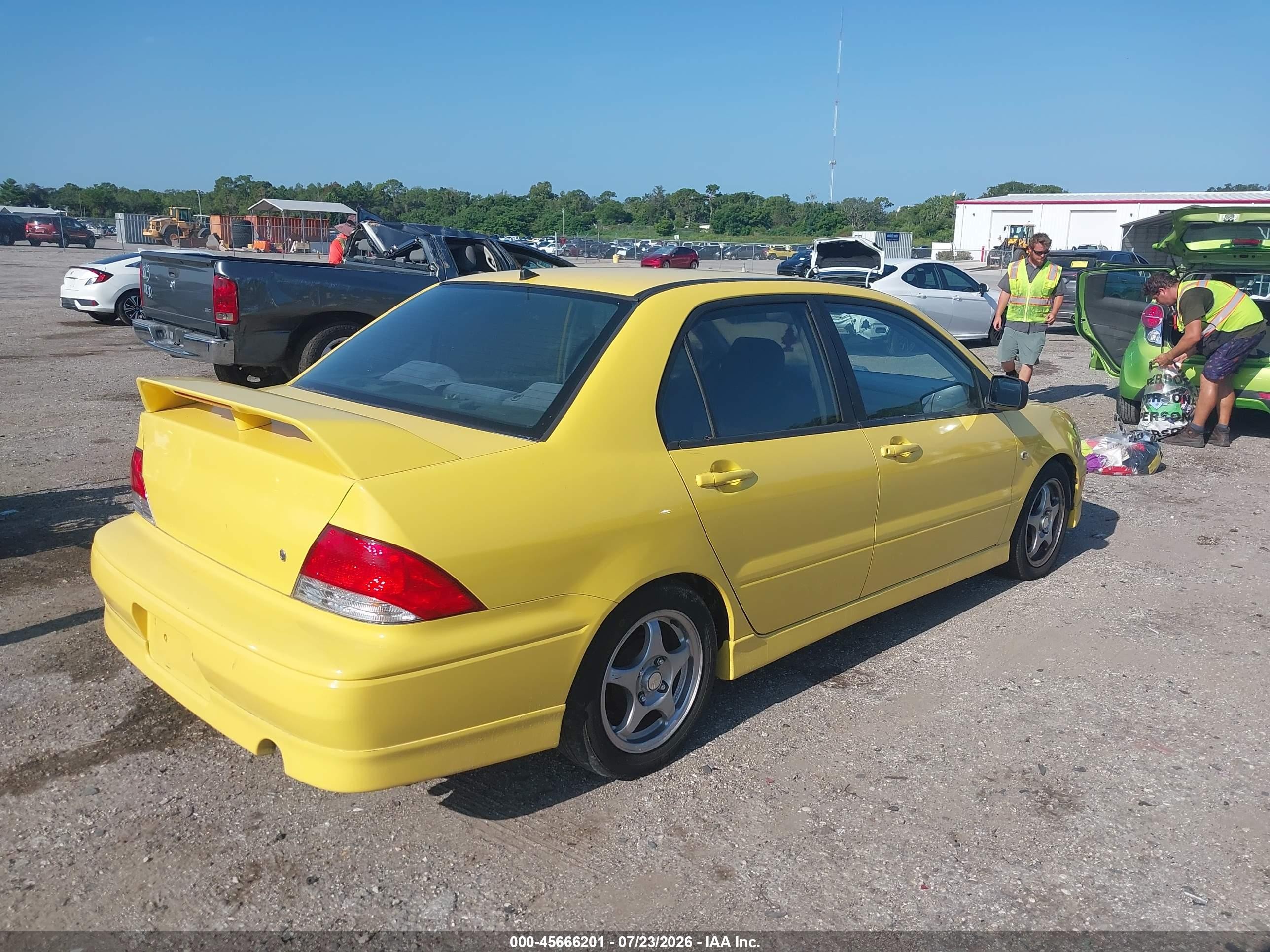 2002 Mitsubishi Lancer Oz Rally Yellow vin: JA3AJ86EX2U082509