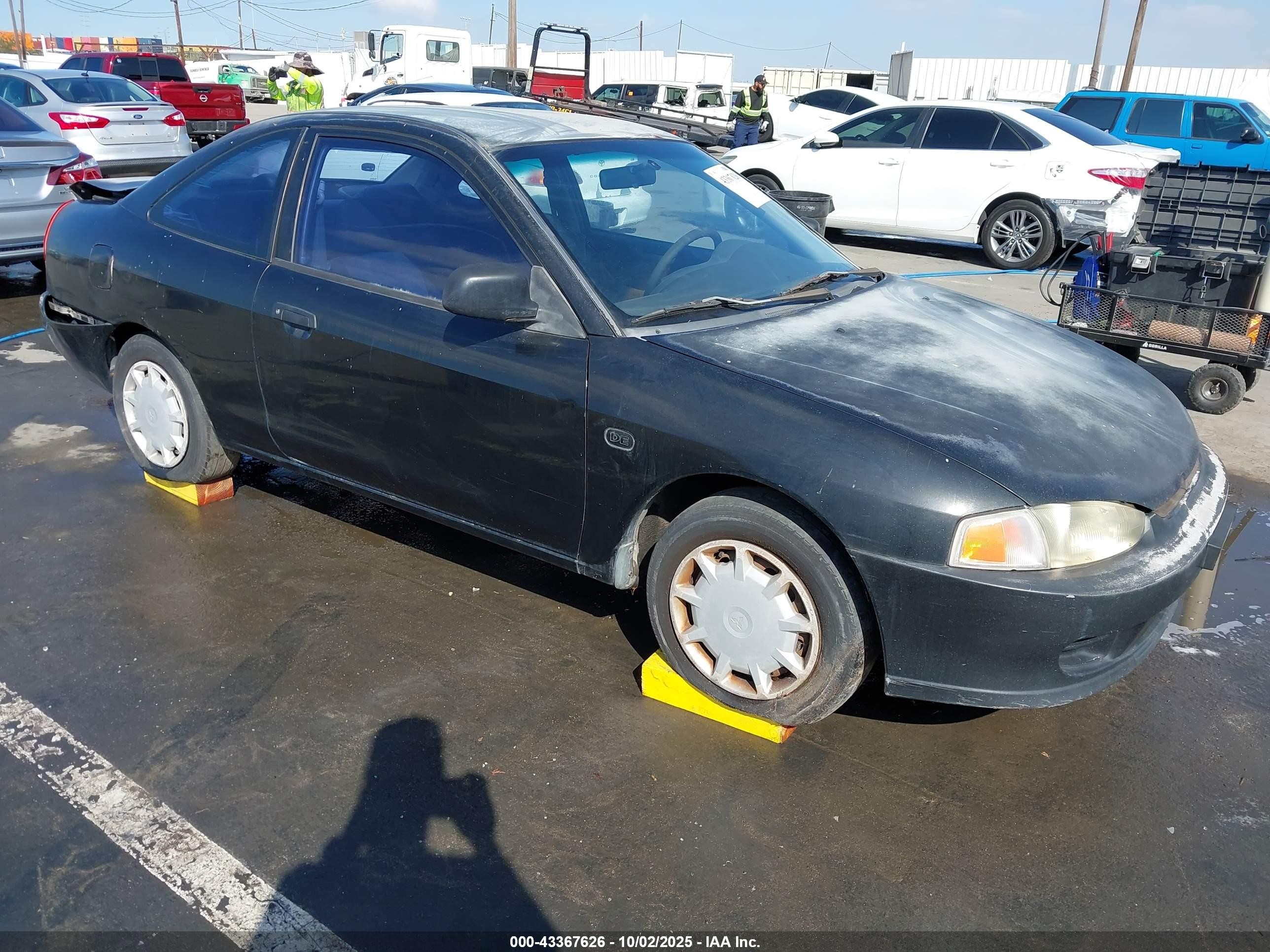 2000 Mitsubishi Mirage De Black vin: JA3AY11A4YU016439