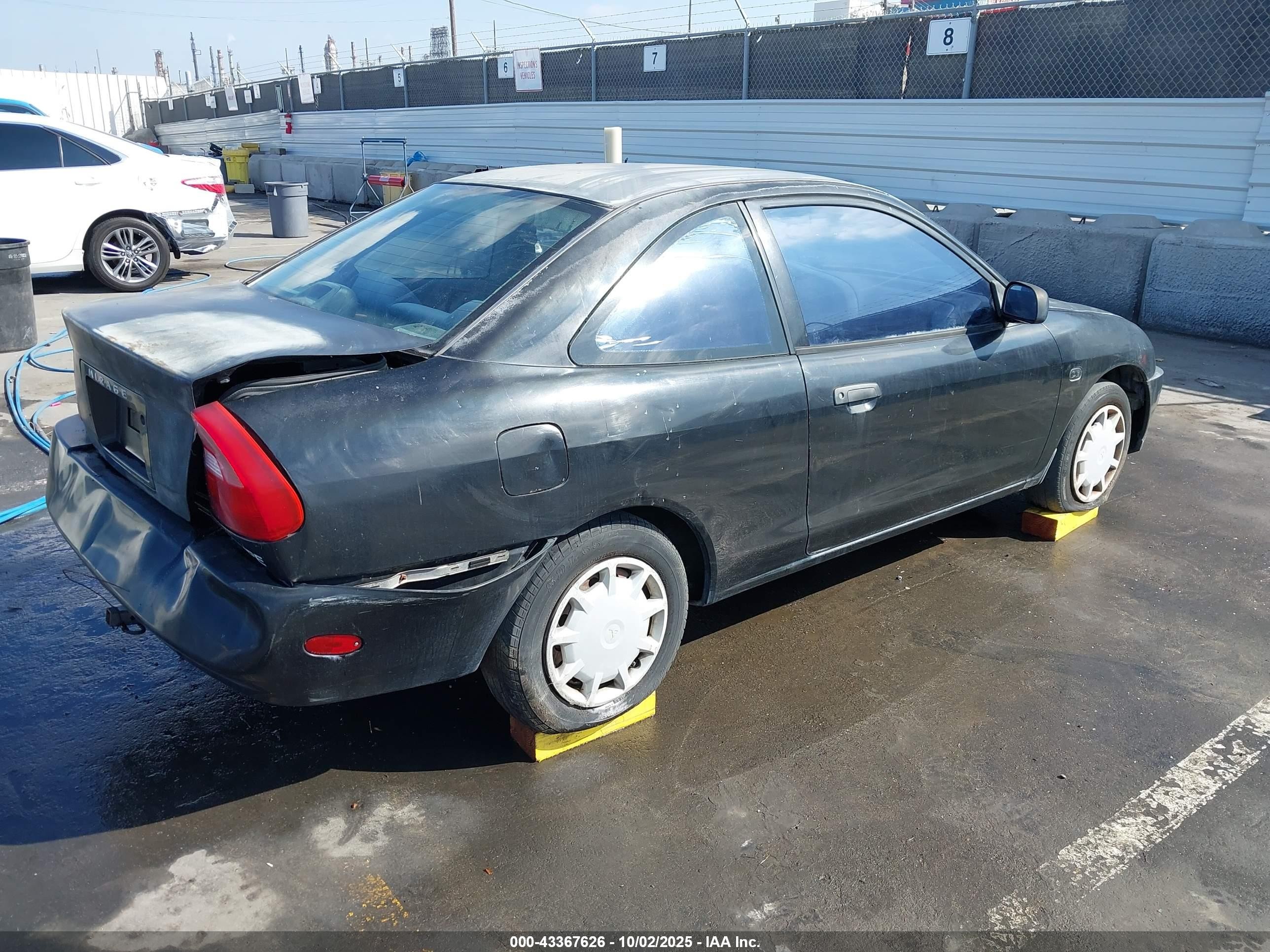 2000 Mitsubishi Mirage De Black vin: JA3AY11A4YU016439