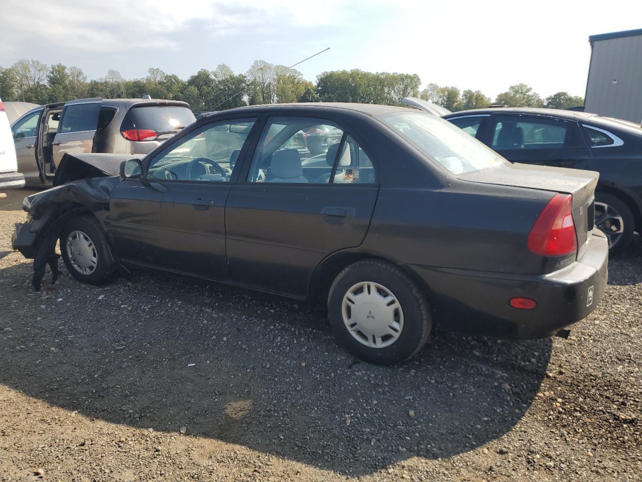 1999 Mitsubishi Mirage De Black vin: JA3AY26A0XU021702