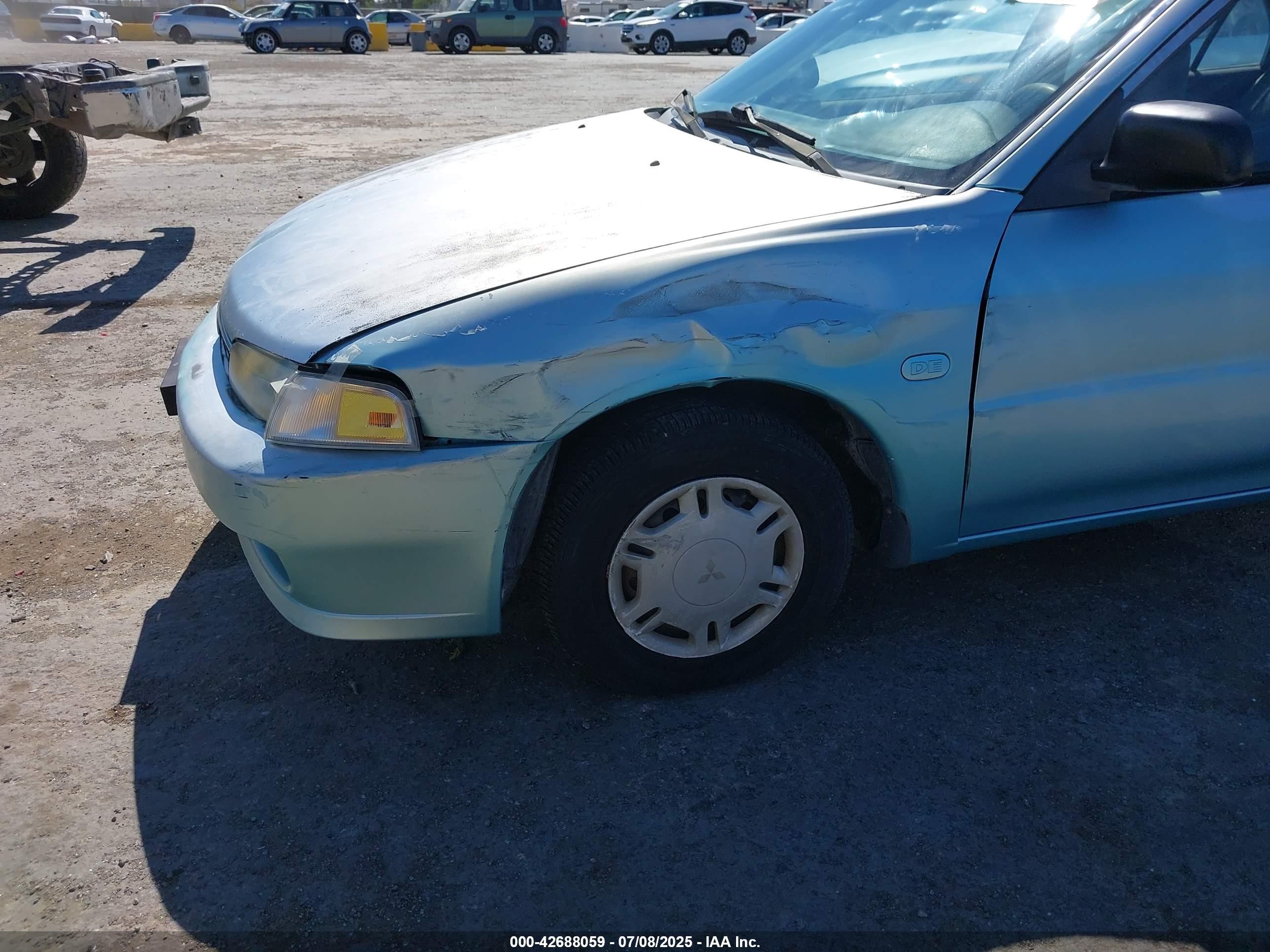 1997 Mitsubishi Mirage De Blue vin: JA3AY26A1VU011032