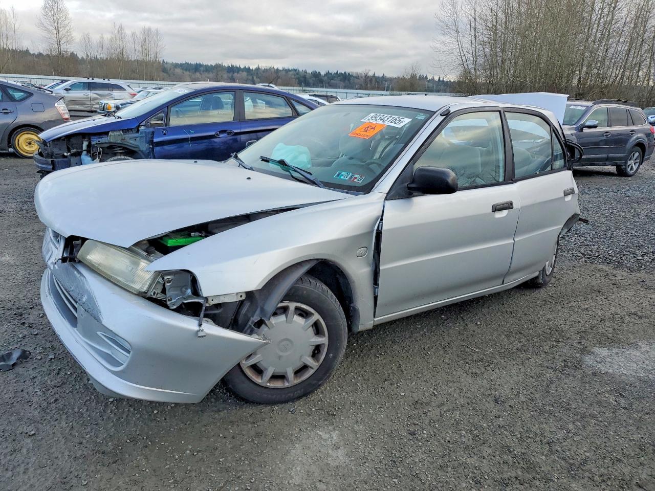 2001 Mitsubishi Mirage Es Silver vin: JA3AY26C71U040255