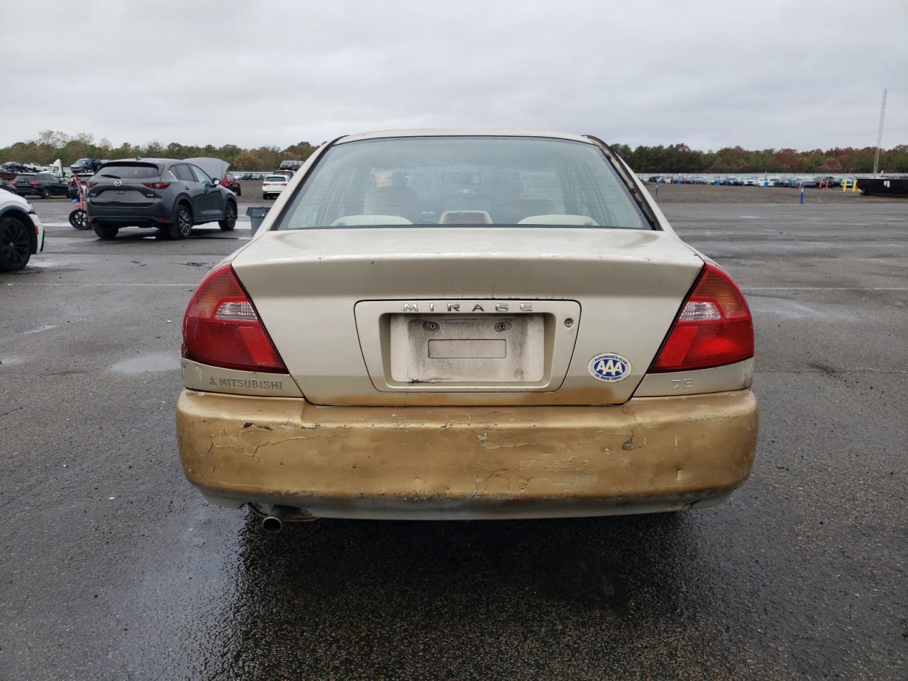 2000 Mitsubishi Mirage De Tan vin: JA3AY26C8YU036516