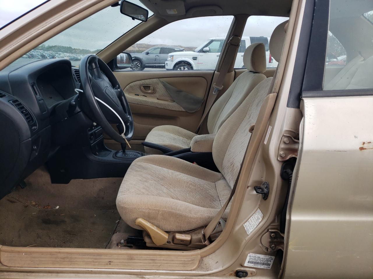 2000 Mitsubishi Mirage De Tan vin: JA3AY26C8YU036516