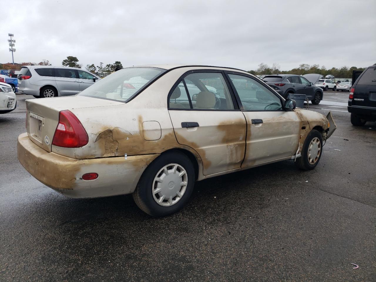 2000 Mitsubishi Mirage De Tan vin: JA3AY26C8YU036516
