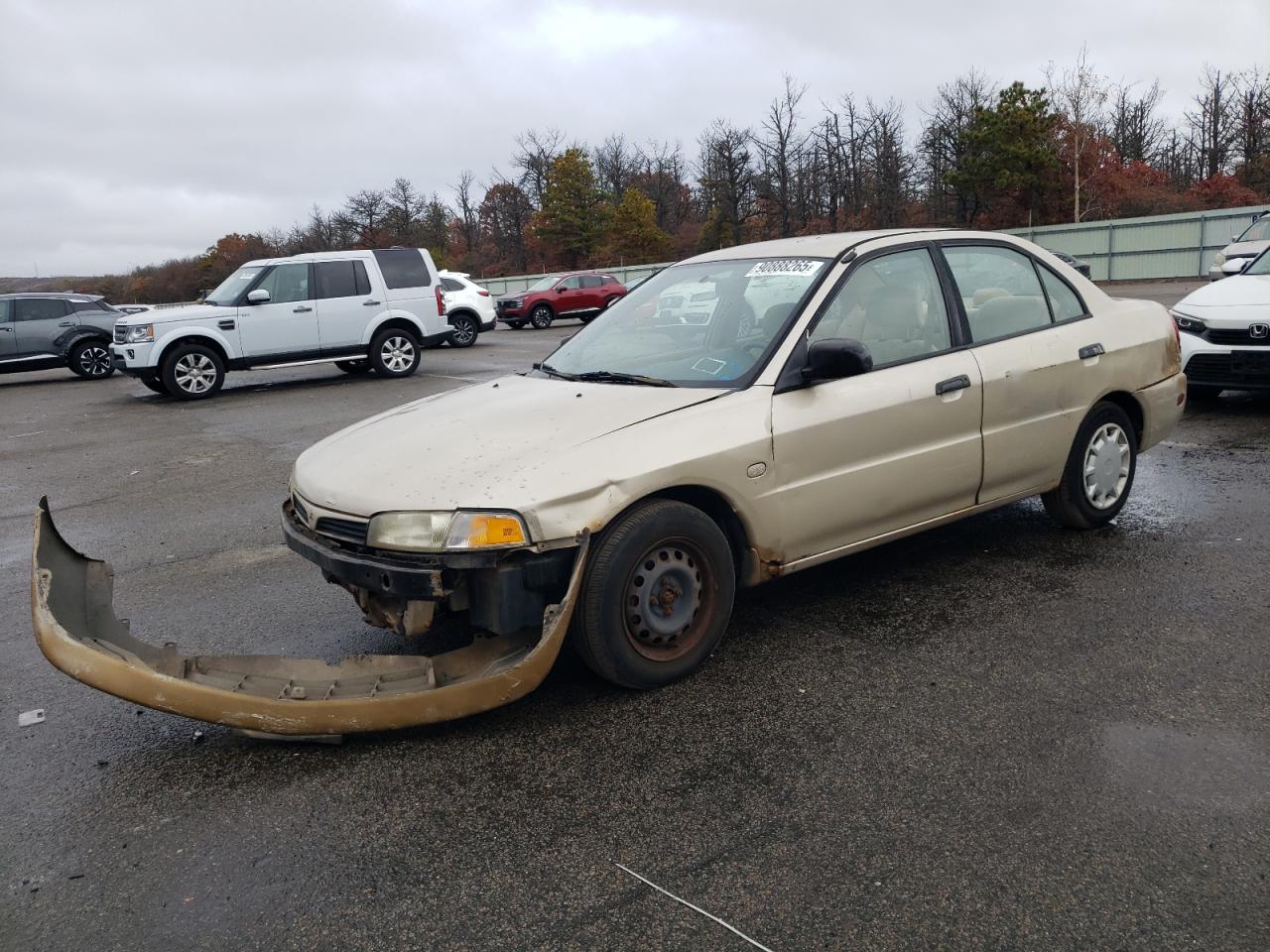 2000 Mitsubishi Mirage De Tan vin: JA3AY26C8YU036516