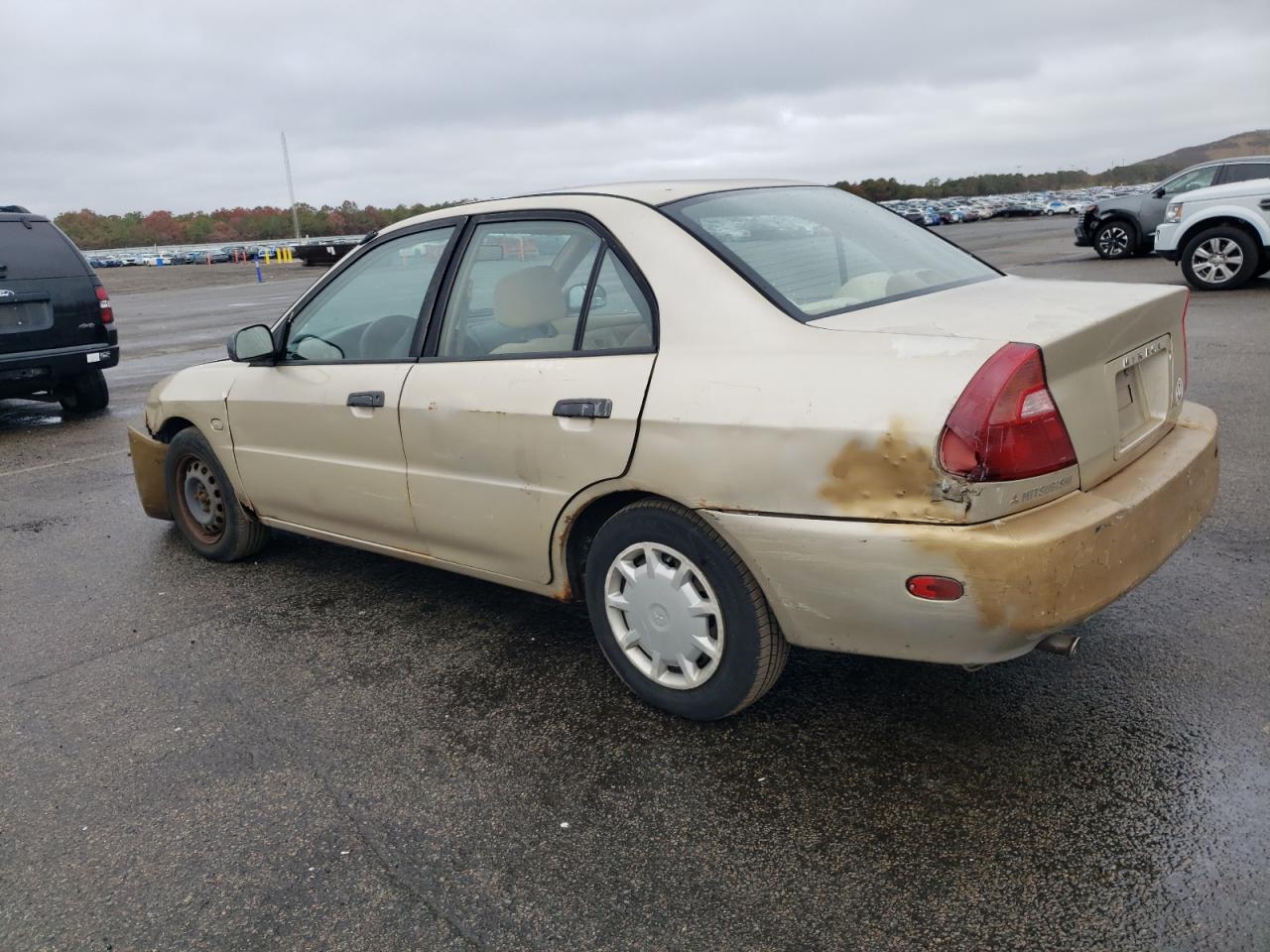 2000 Mitsubishi Mirage De Tan vin: JA3AY26C8YU036516