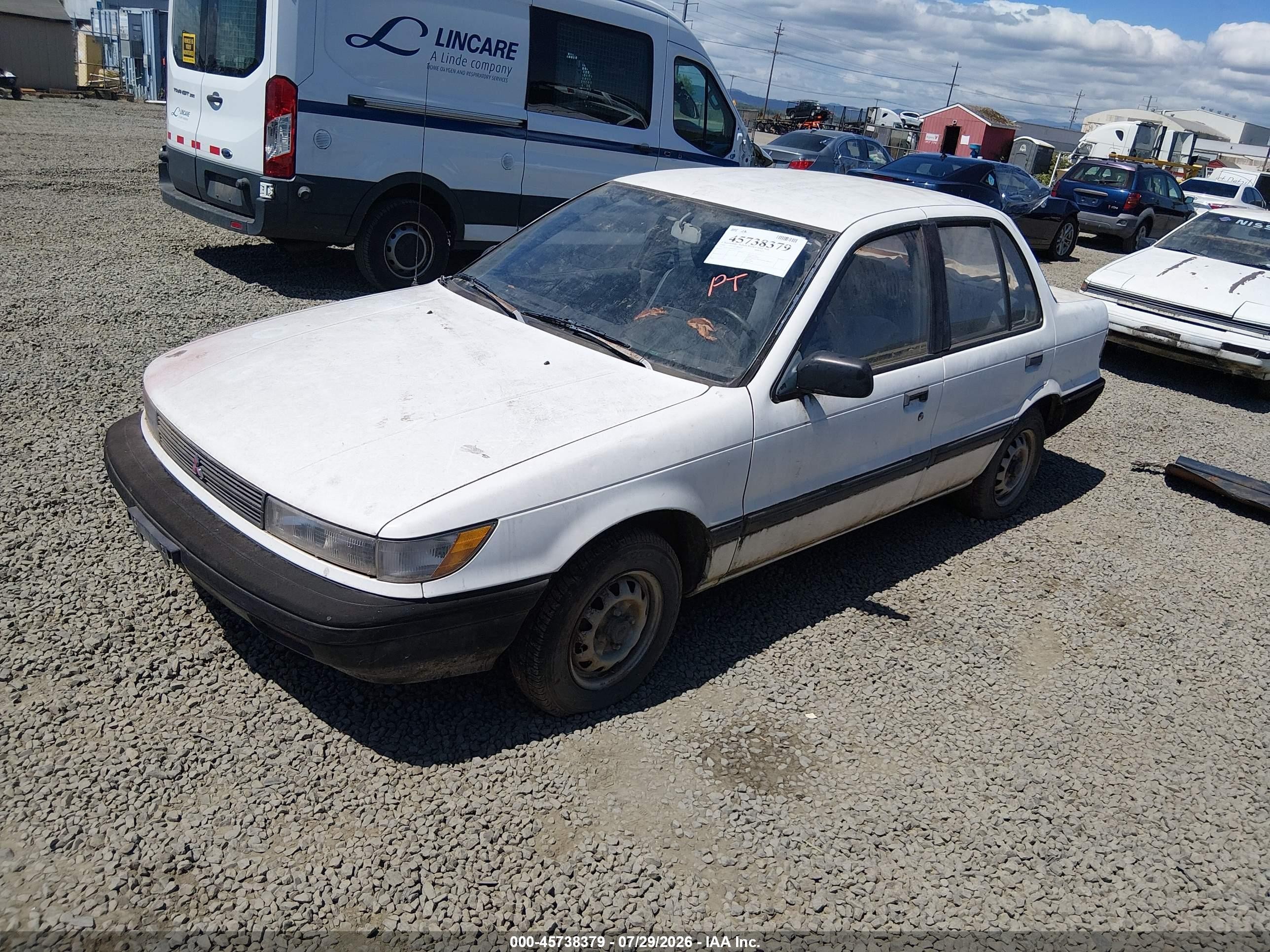 1990 Mitsubishi Mirage   White vin: JA3CU26XXLU031415