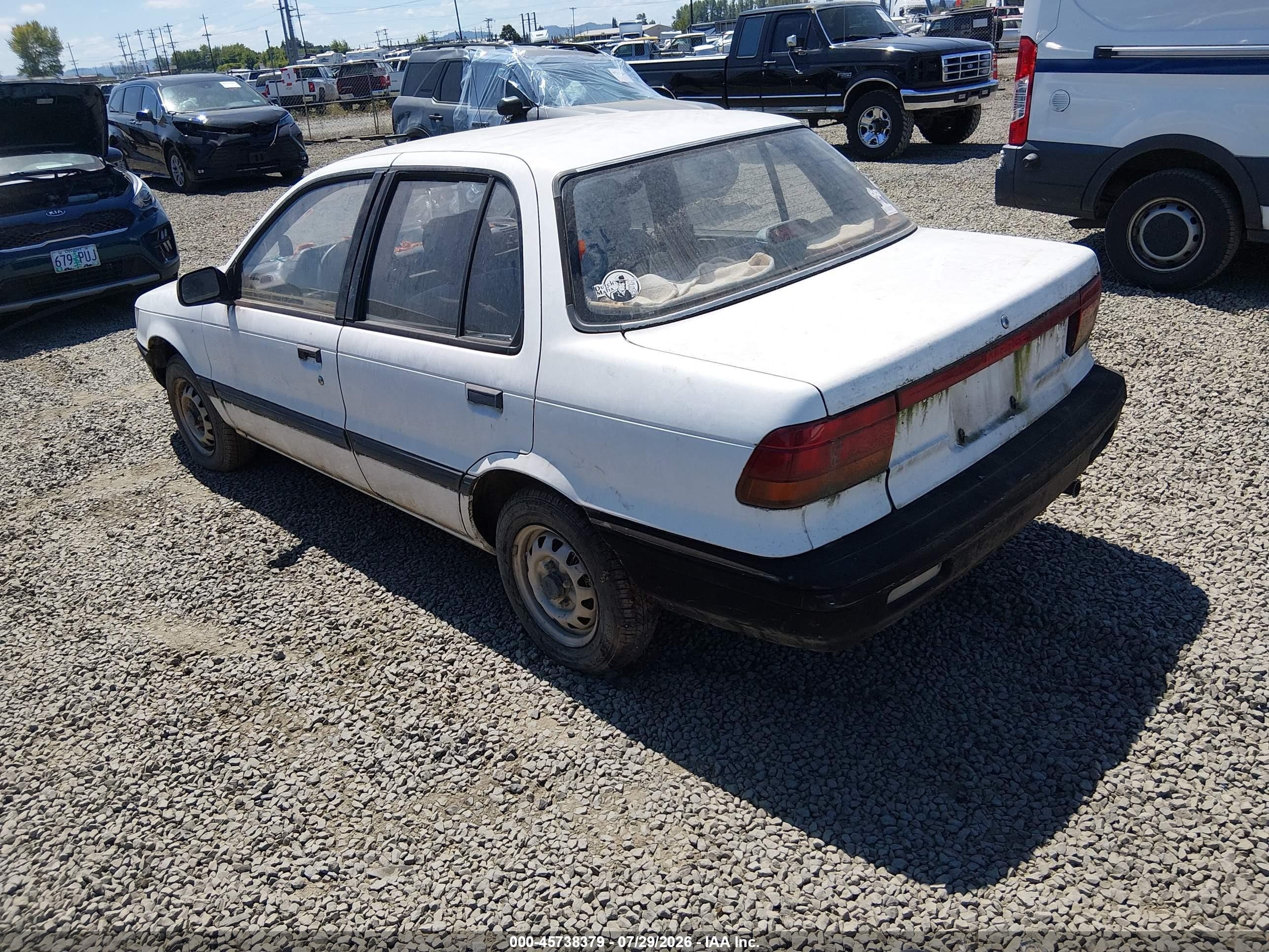 1990 Mitsubishi Mirage   White vin: JA3CU26XXLU031415