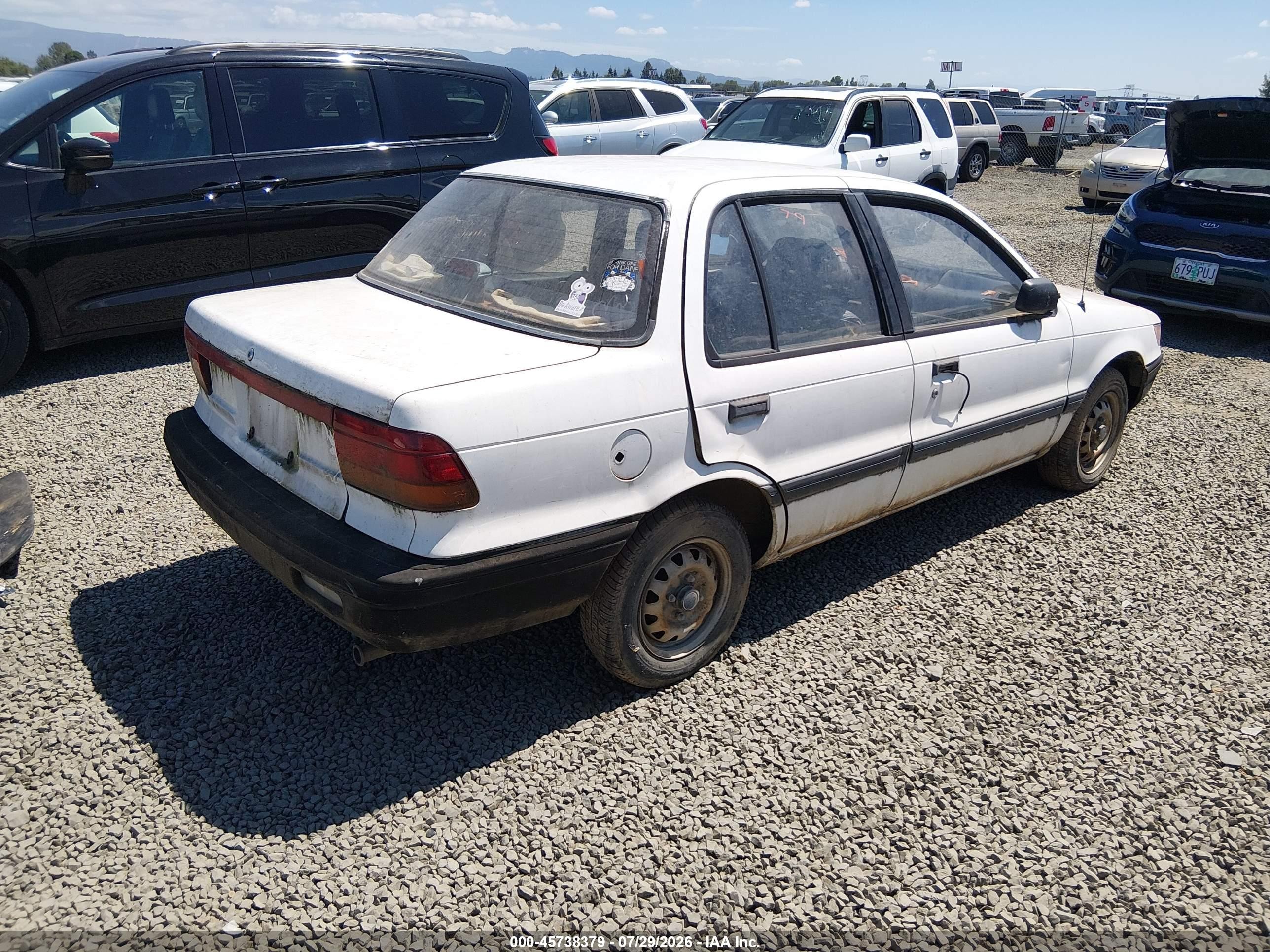 1990 Mitsubishi Mirage   White vin: JA3CU26XXLU031415