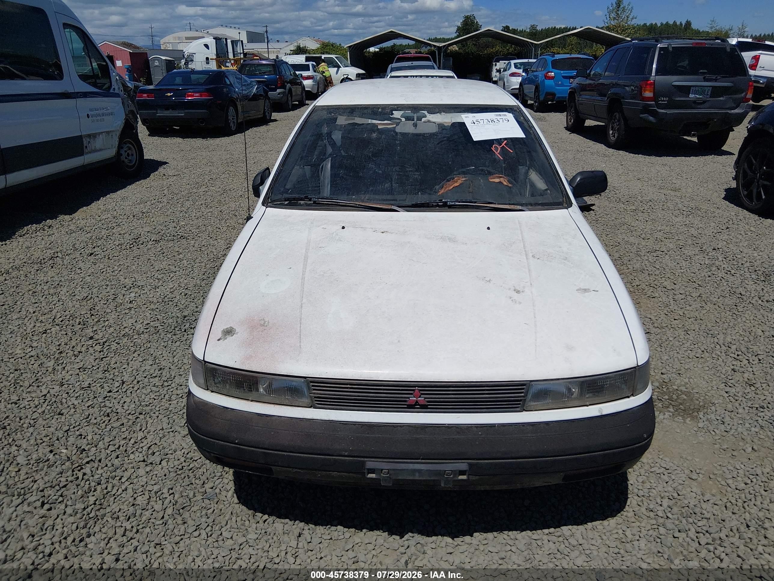 1990 Mitsubishi Mirage   White vin: JA3CU26XXLU031415