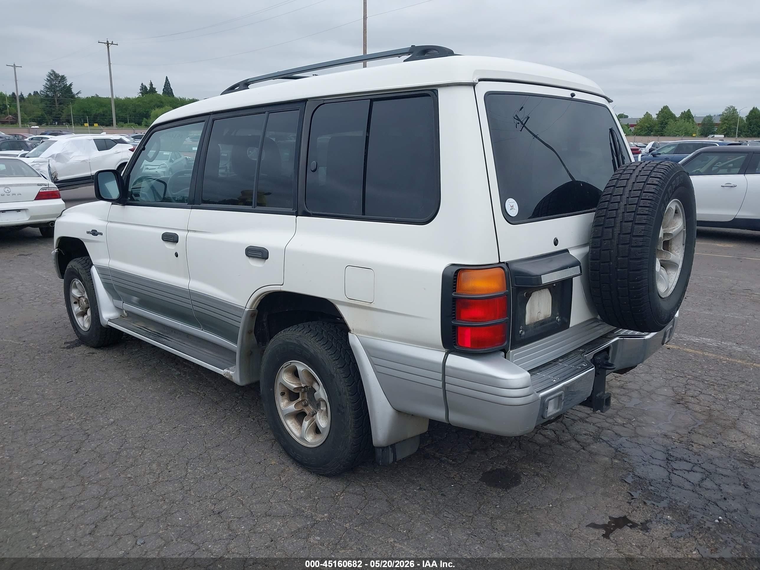 1998 Mitsubishi Montero   White vin: JA4MR51R5WJ001594