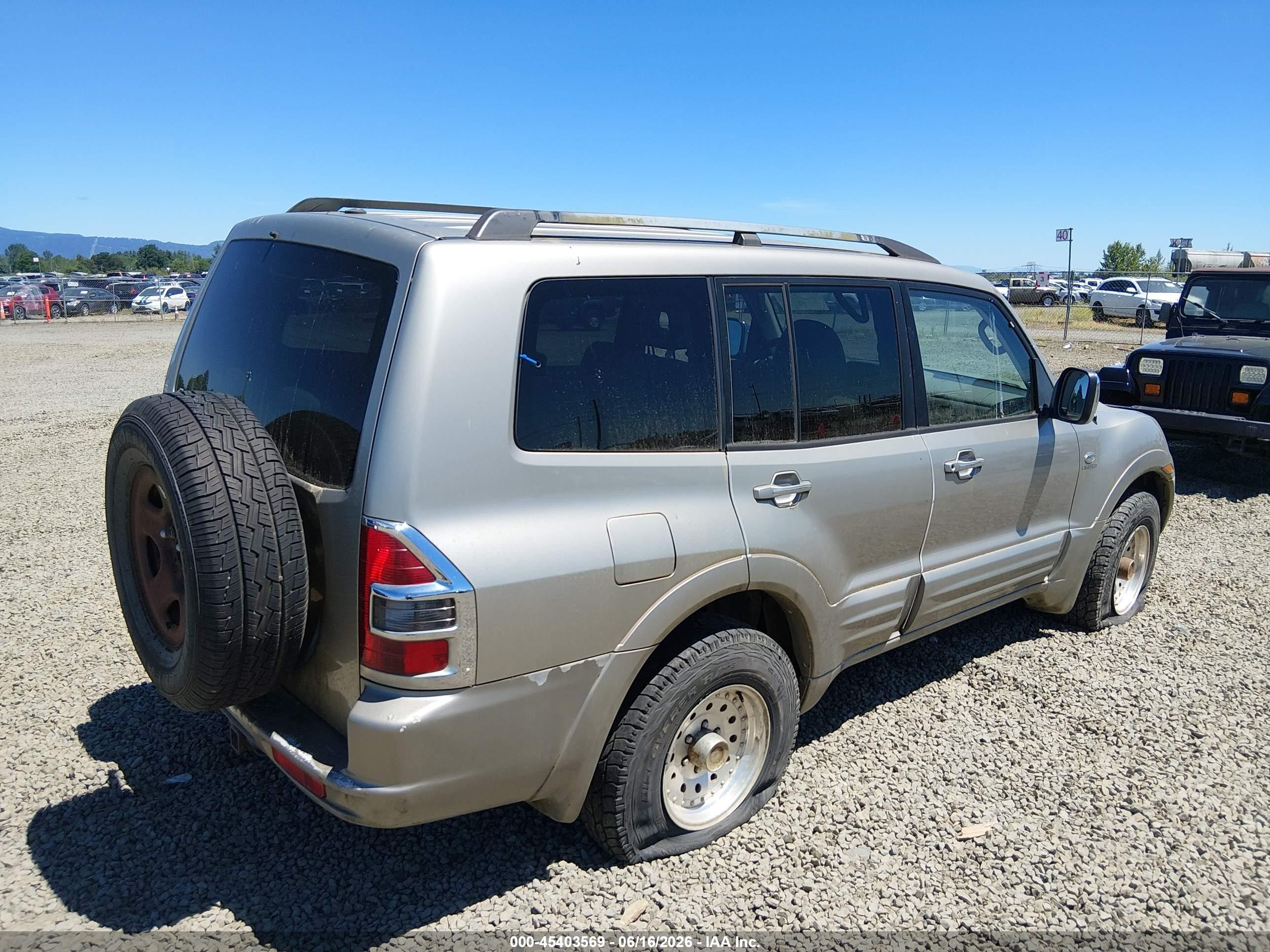 2001 Mitsubishi Montero Limited Champagne vin: JA4MW51R01J003240