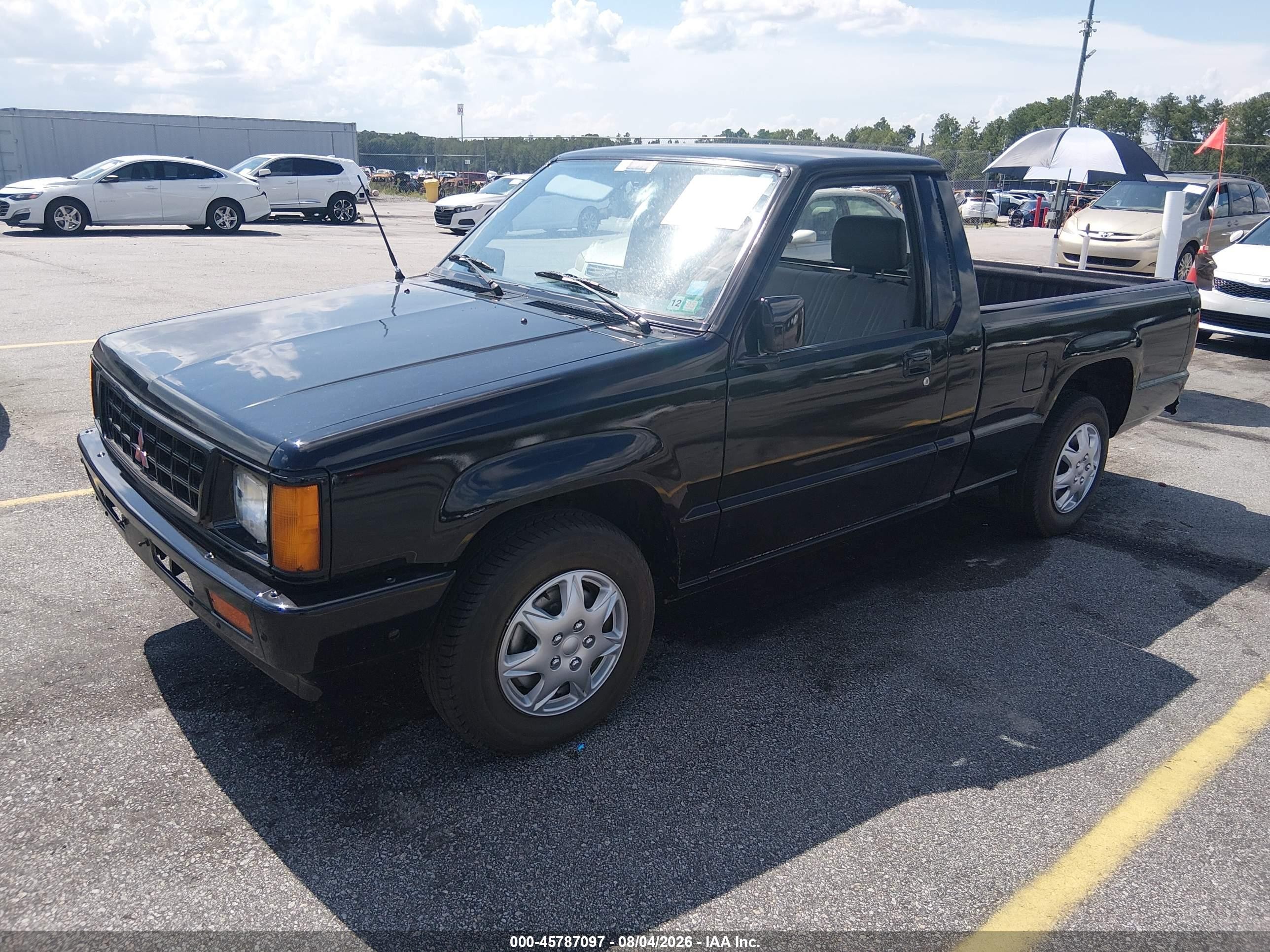 1990 Mitsubishi Mighty Max / S   Black vin: JA7FL24W1LP011061