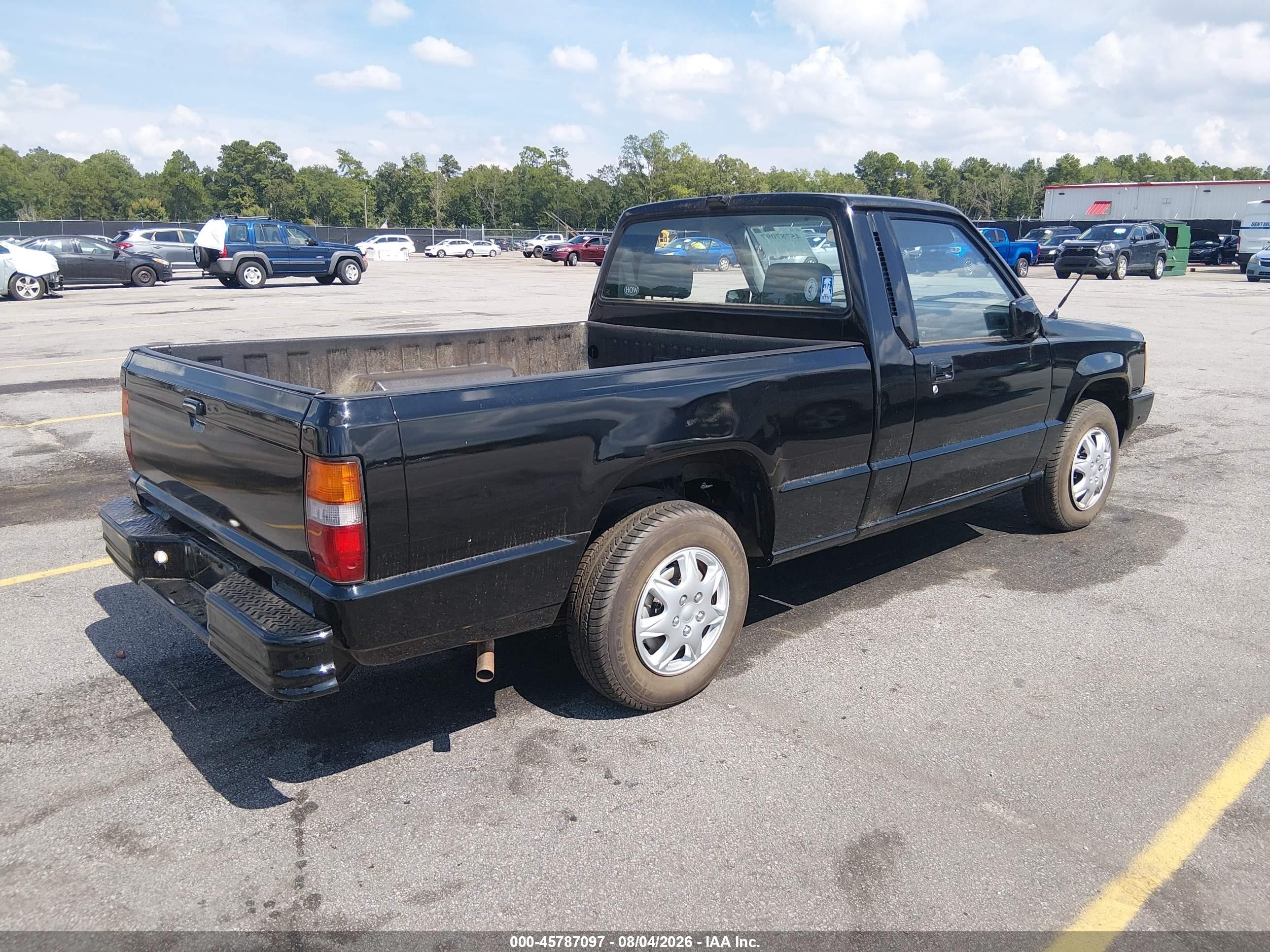1990 Mitsubishi Mighty Max / S   Black vin: JA7FL24W1LP011061