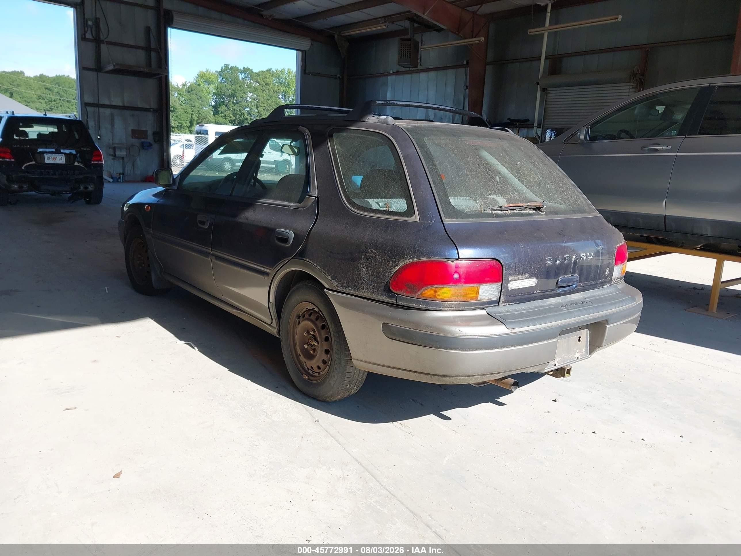 1996 Subaru Impreza Outback Blue vin: JF1GF4856TG814191