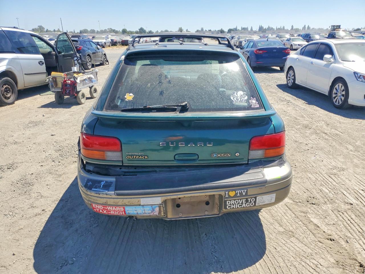 2000 Subaru Impreza Outback Sport Green vin: JF1GF4857YH804030