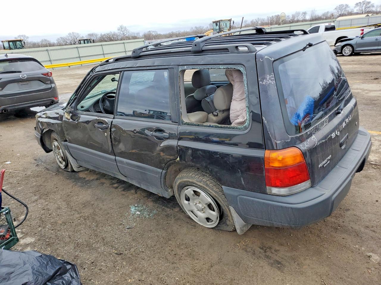 1999 Subaru Forester L Black vin: JF1SF6356XG710741