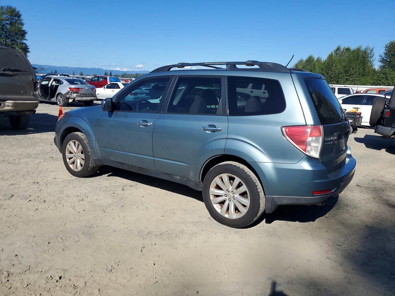 2011 Subaru Forester Limited Teal vin: JF2SHAEC9BH757012