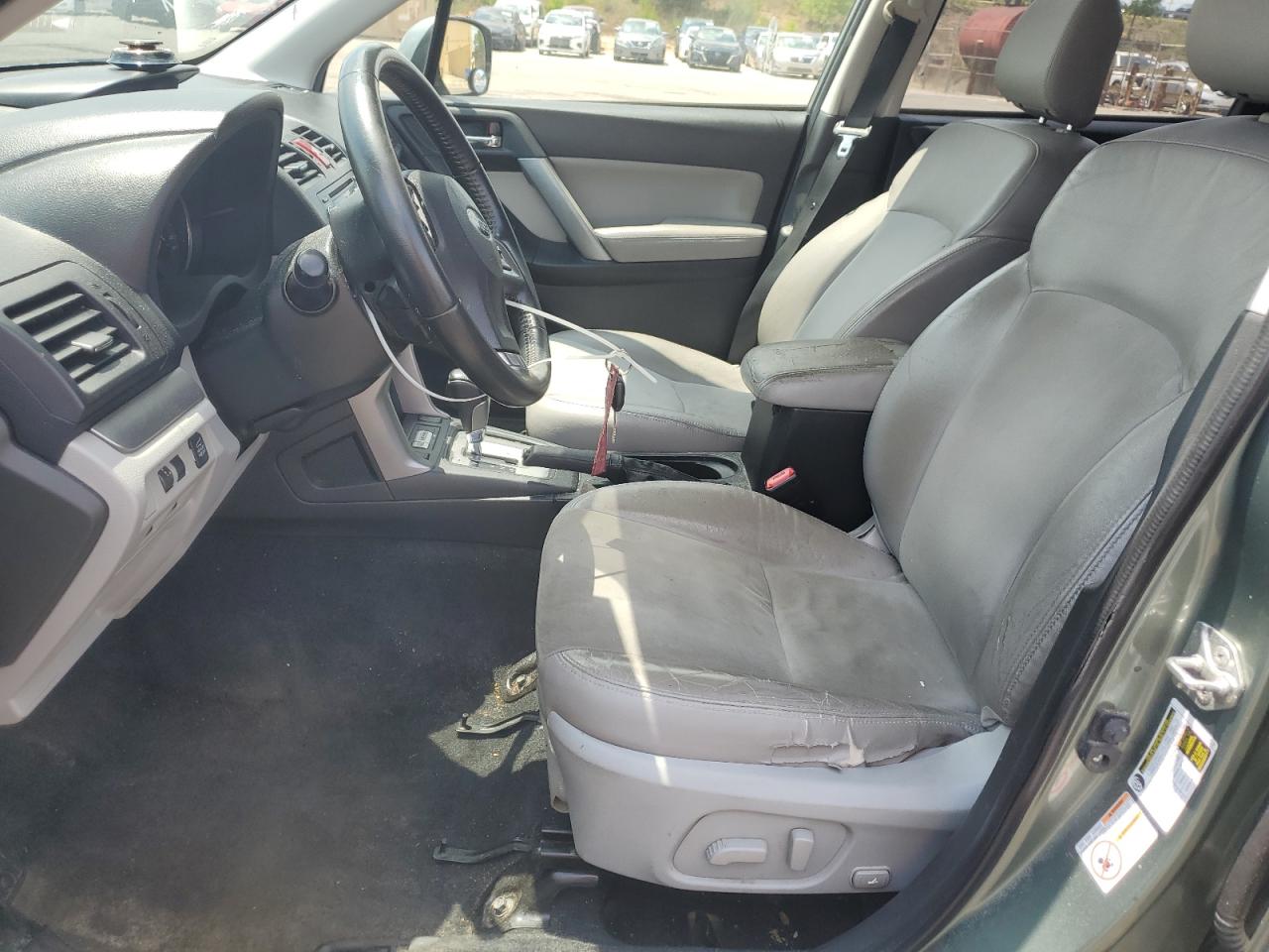2014 Subaru Forester 2.5i Limited Green vin: JF2SJAHC6EH433942 Damage: Left Front Seat Cushion, Torn, 5 To 6 Inches