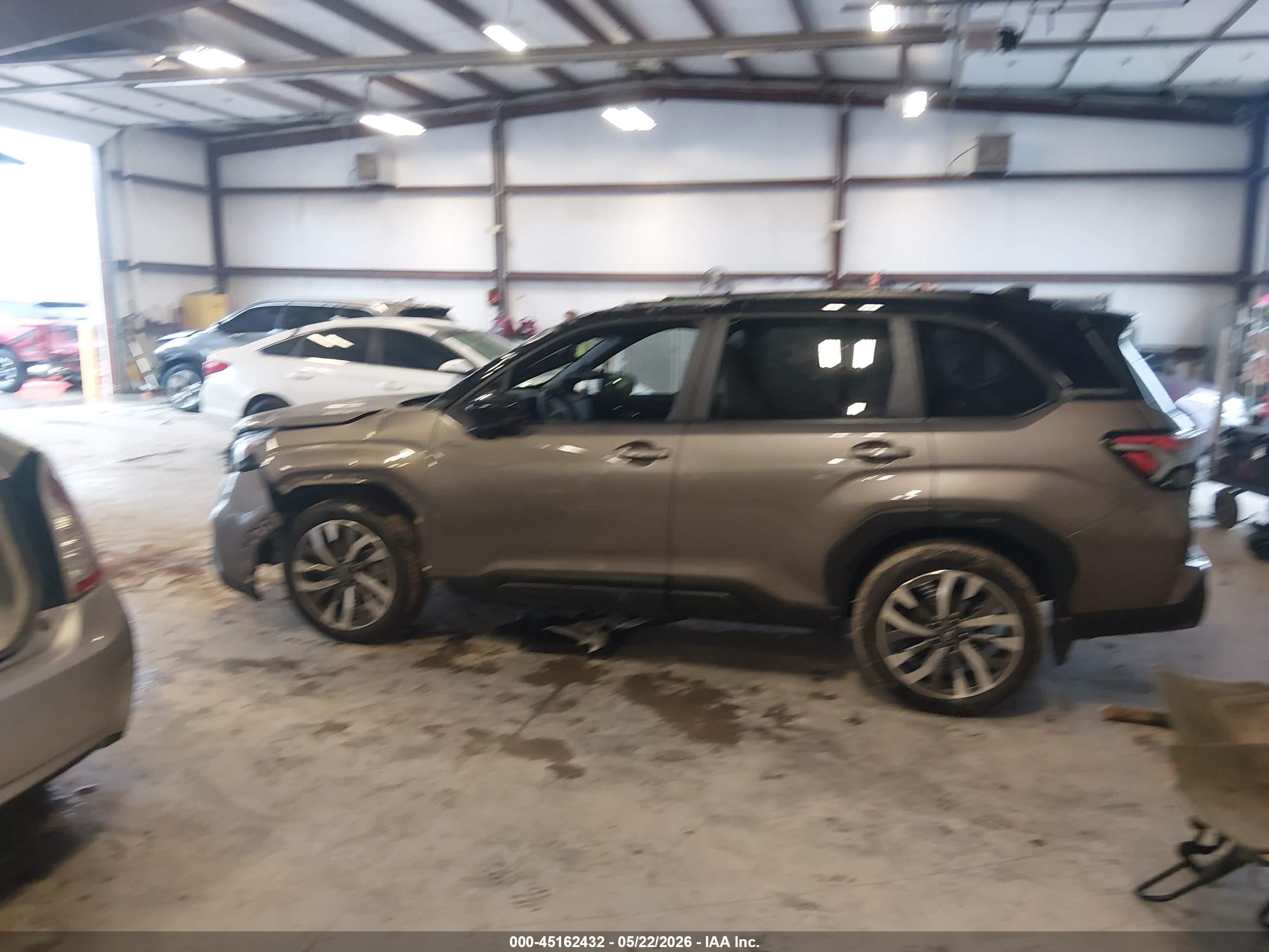 2025 Subaru Forester Touring Hybrid Tan vin: JF2SLSTD3SH421792