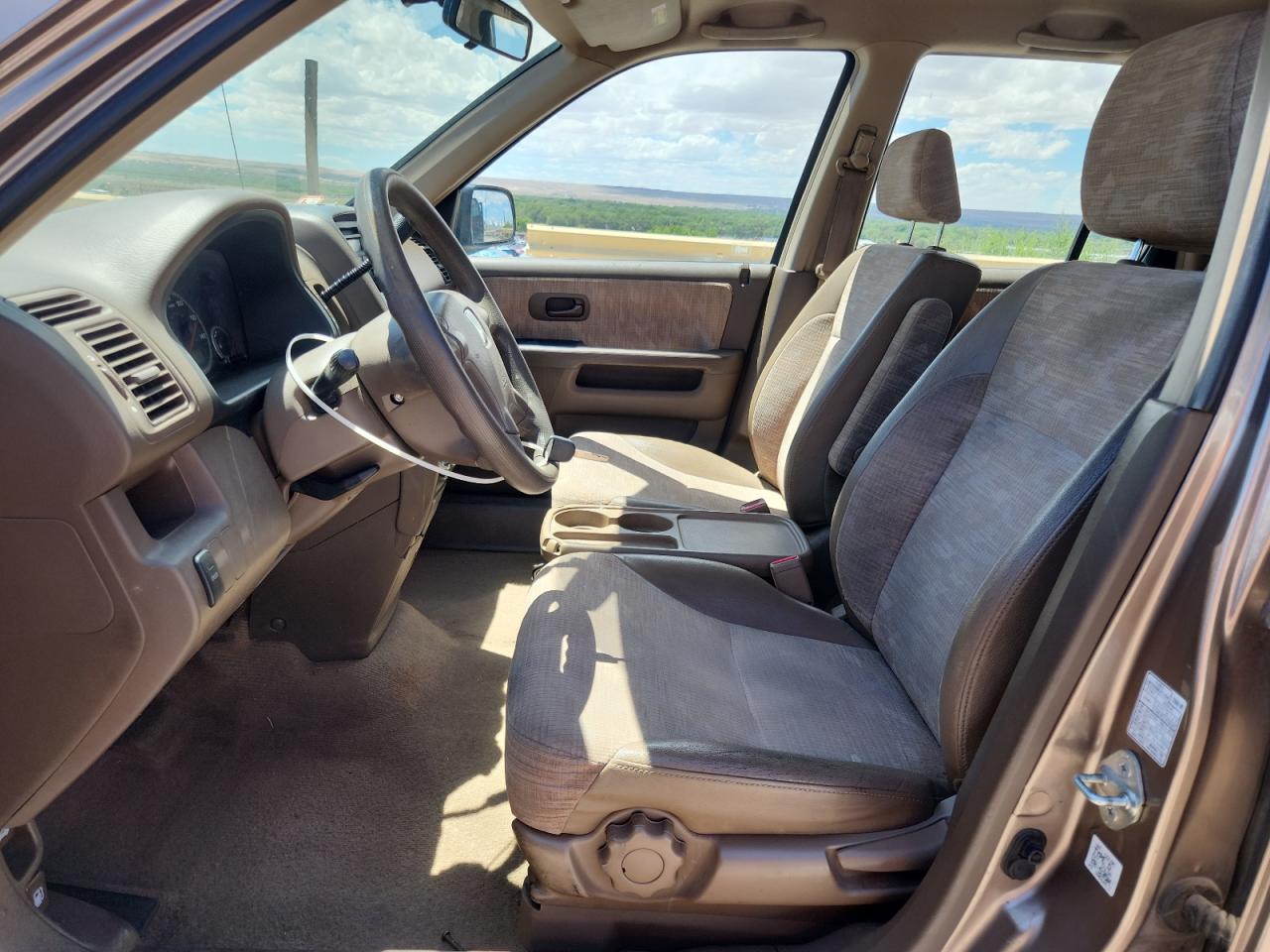 2003 Honda Cr-v Lx Brown vin: JHLRD68433C010839 Damage: Left Front Carpet, Stained, Permanent