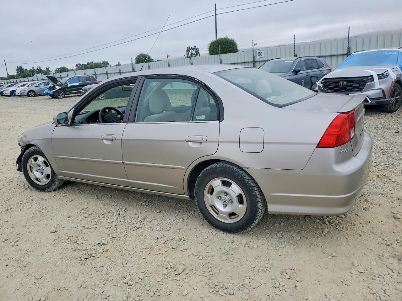 2004 Honda Civic Hybrid Cream vin: JHMES956X4S016569
