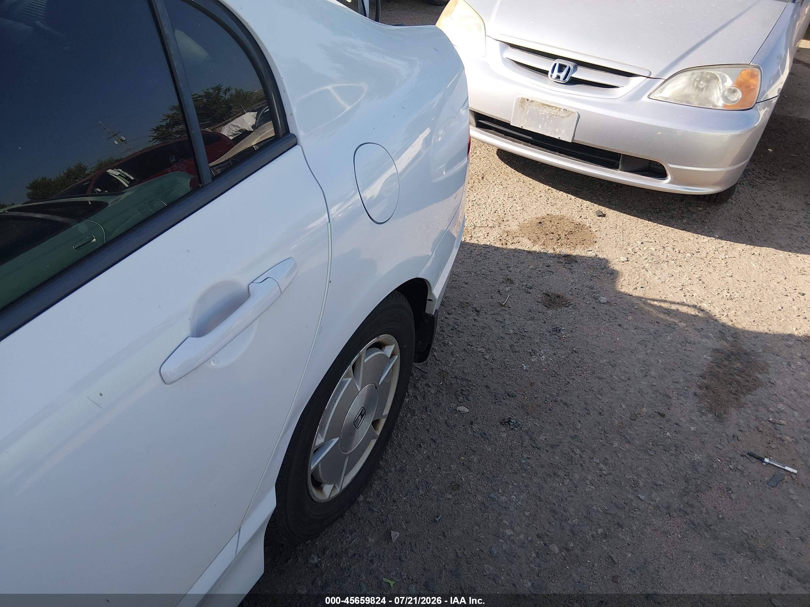2009 Honda Civic Hybrid   White vin: JHMFA36209S004499