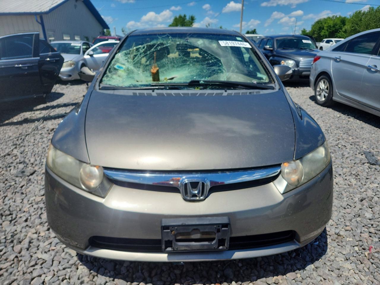2006 Honda Civic Hybrid Gold vin: JHMFA36216S022442